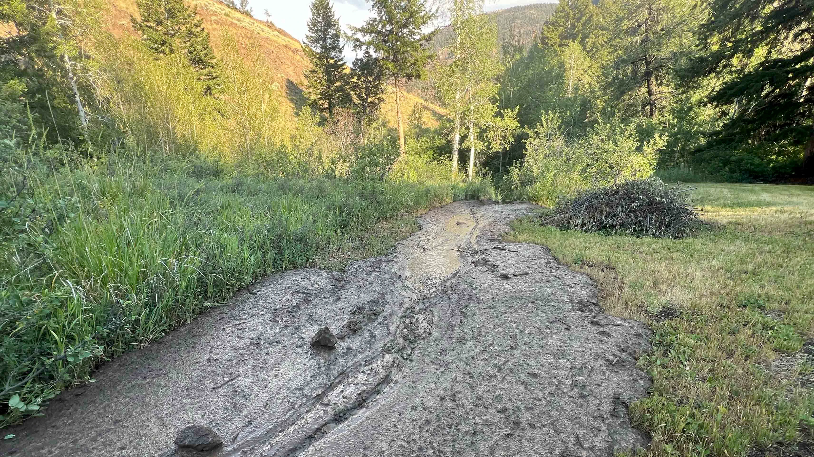 North Fork of Shoshone River, Park County, WY.   We’ve been praying for rain…it all came today, delivering 1+ inches in one hour. Numerous mud slides up and down the valley produced by a long “train” of slow moving south to north thunderstorms.