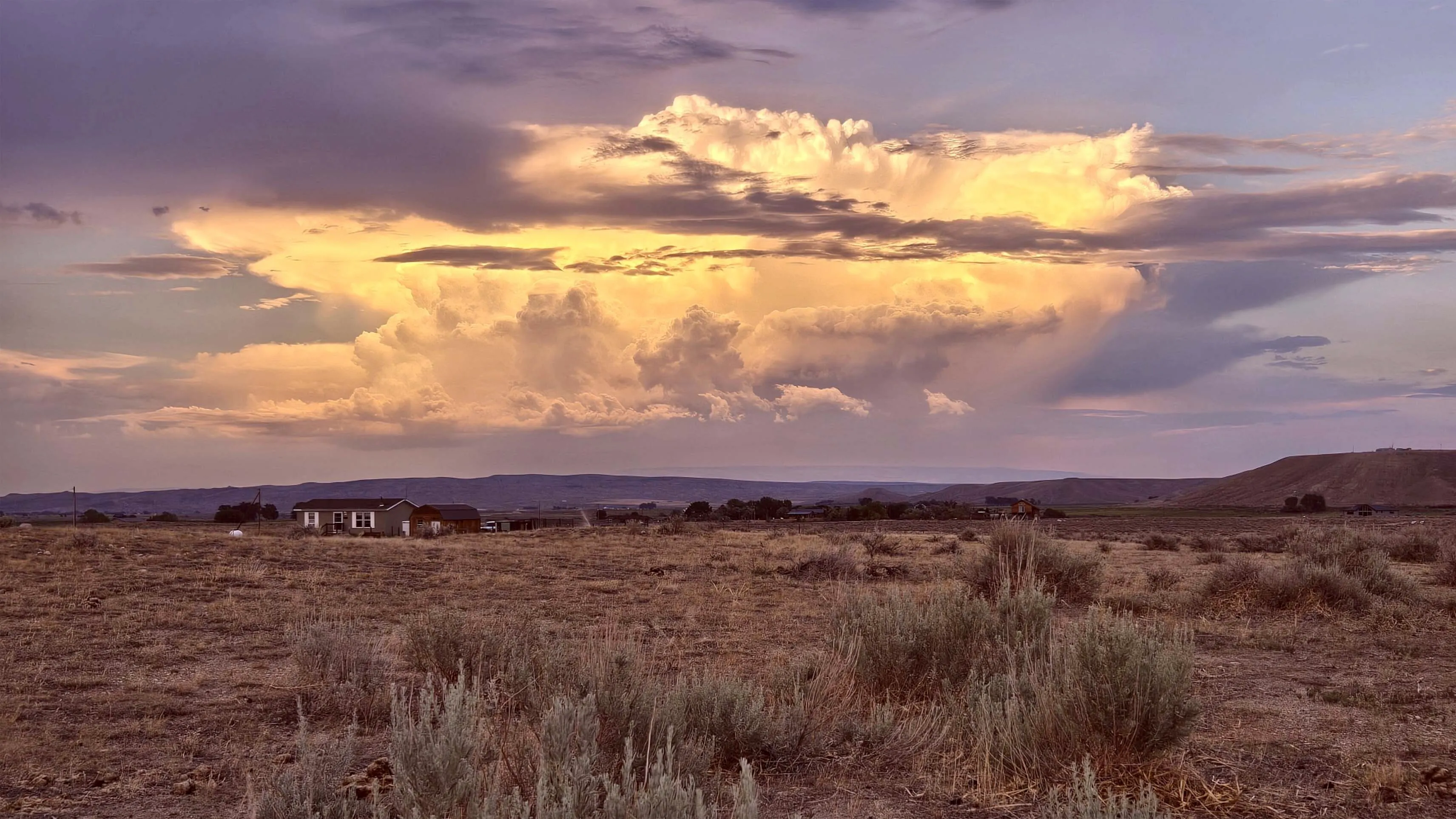 "Evening thunderhead over the Pryor Mountains from Clark, Wyoming"