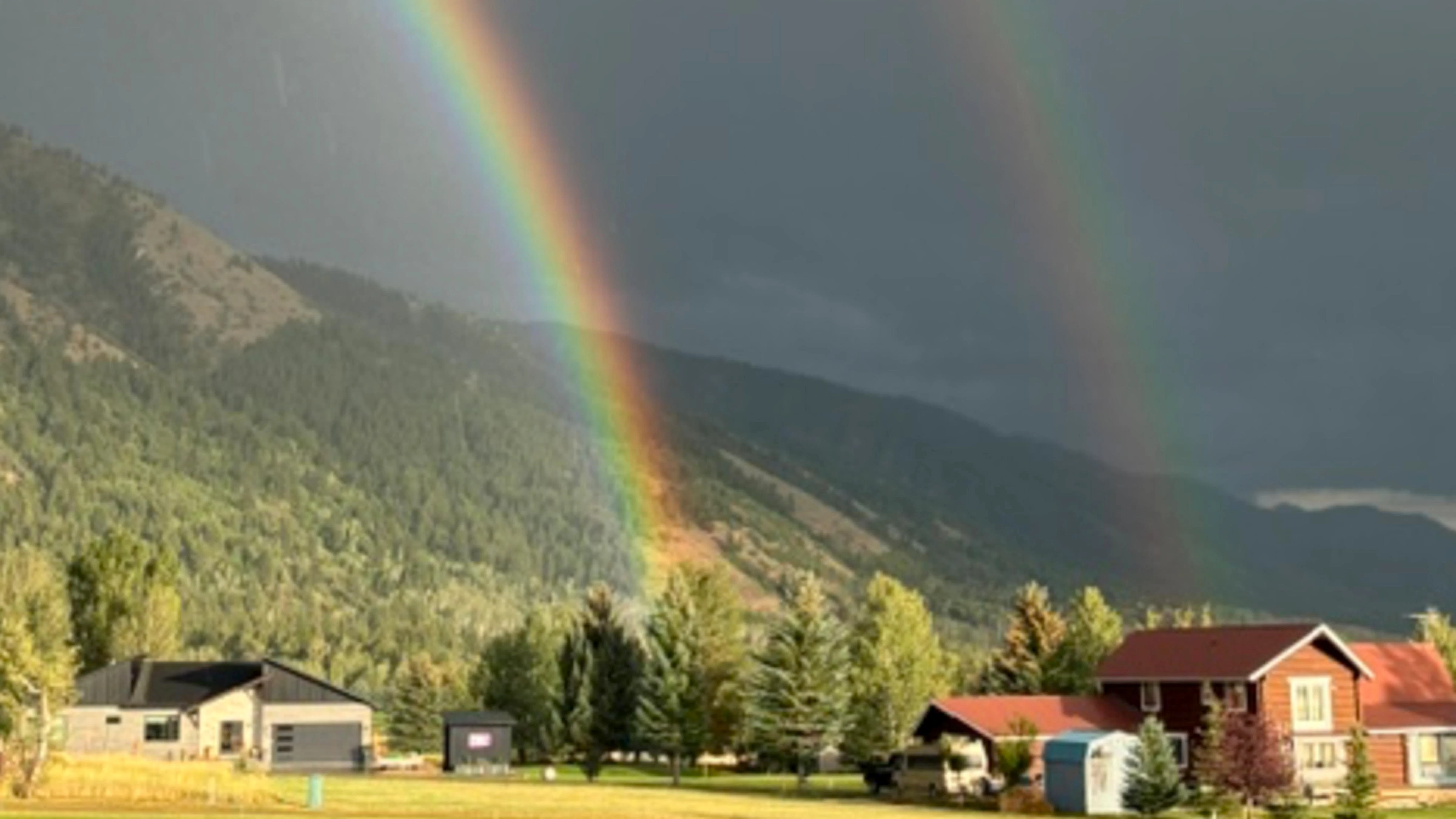 "Storm rolling into Star Valley Ranch with double rainbow."