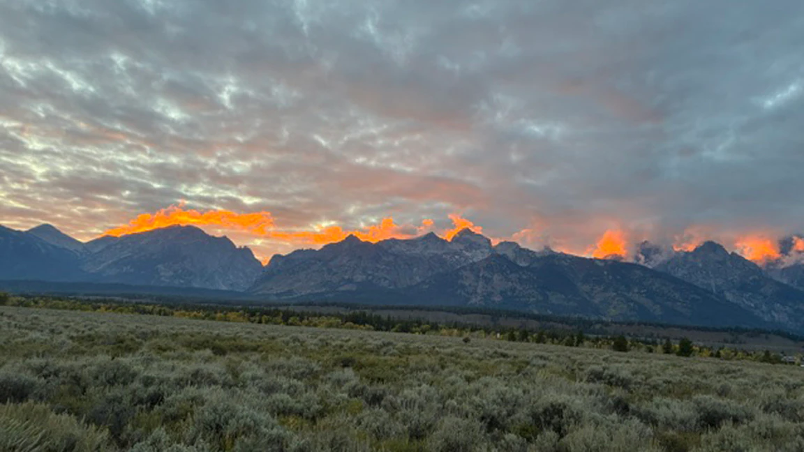 "Fire on the mountain. Sunset on the Teton Range."