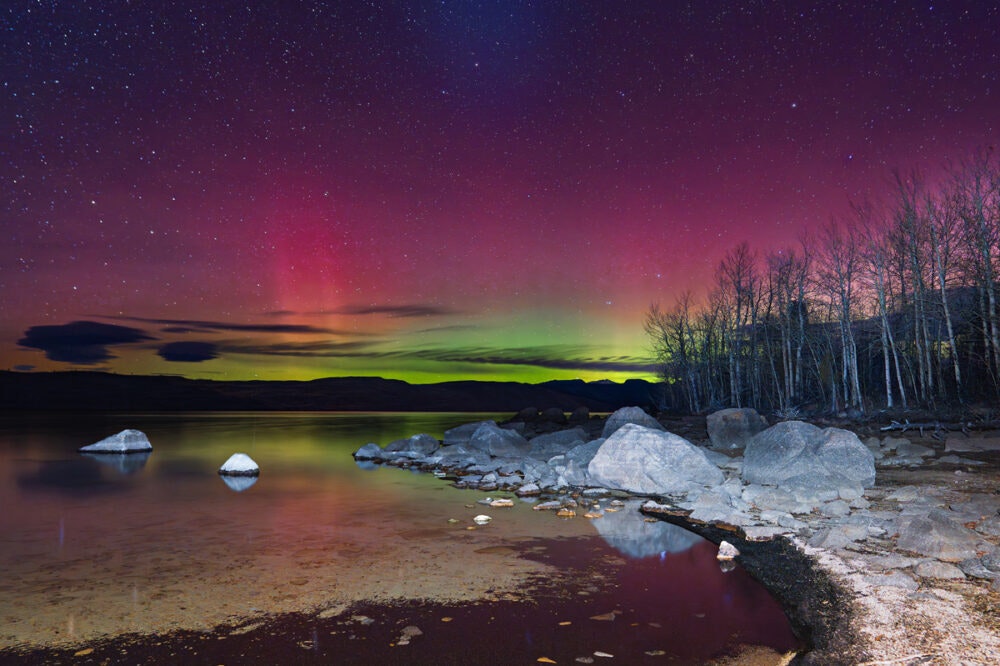 "Another beautiful display of the Northern Lights — this time from Fremont Lake, a place so dear to the people of Pinedale. The colors danced differently tonight — soft pinks and purples, not as bright as the night before, but still full of wonder."