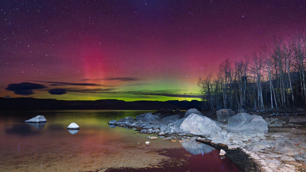 "Another beautiful display of the Northern Lights — this time from Fremont Lake, a place so dear to the people of Pinedale. The colors danced differently tonight — soft pinks and purples, not as bright as the night before, but still full of wonder."