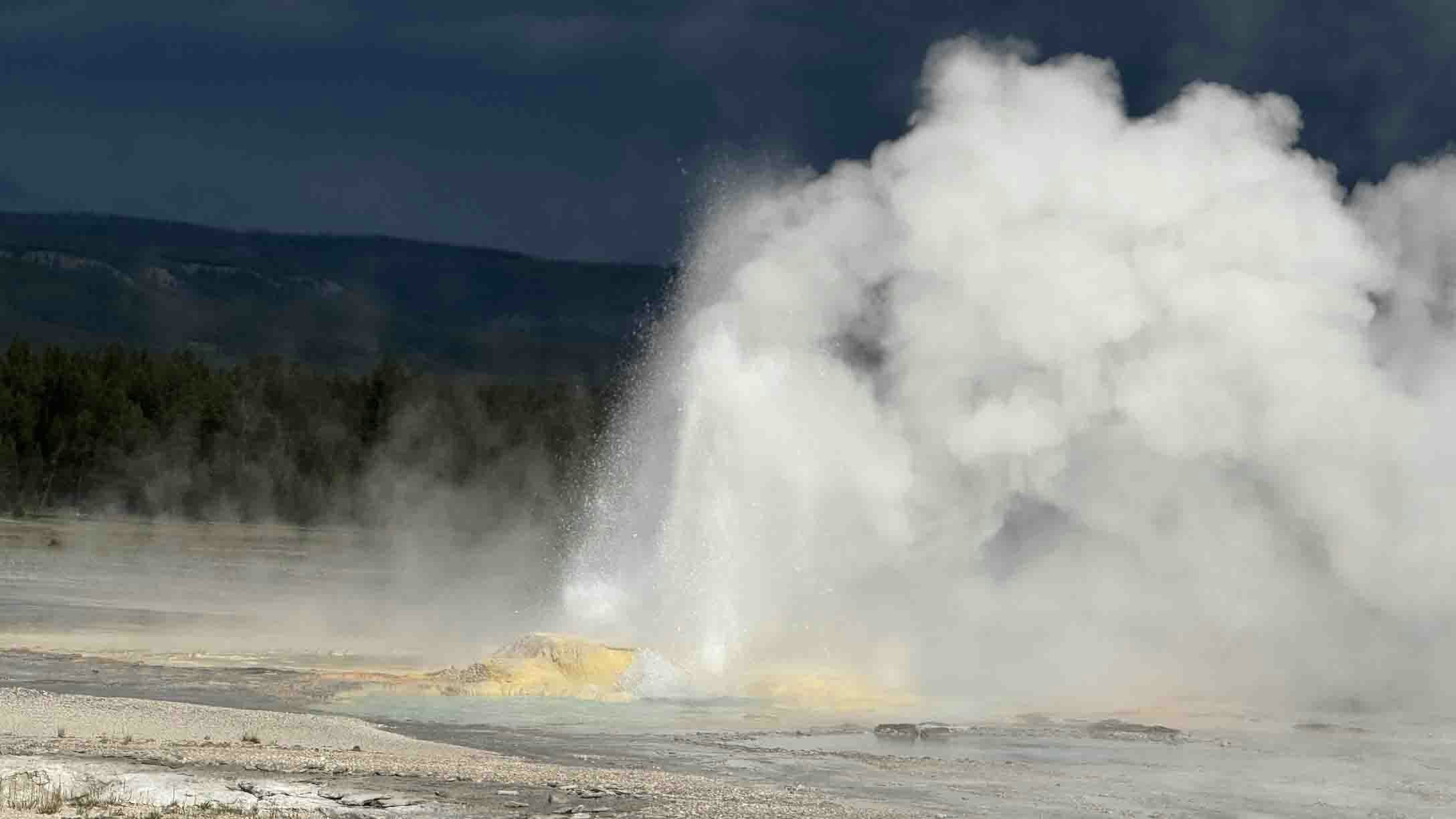 Storms brewing behind Clepsydra Geyser in Lower Geyser Basin in Yellowstone.