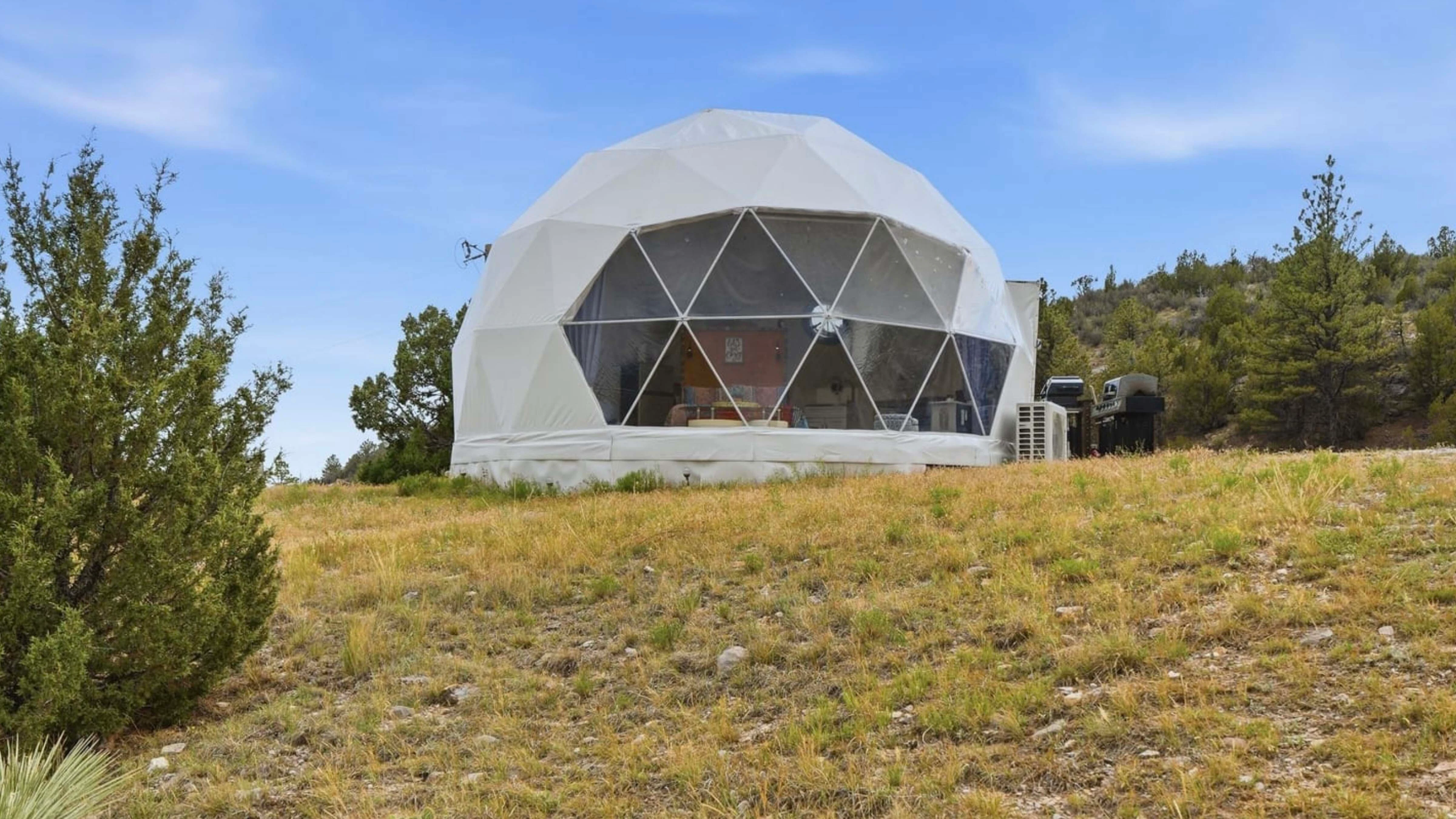 Cedar Lights Retreat is a three-story, five-bedroom, four-bath almost-mansion tucked into 446 private acres bordering Guernsey State Park. The property, which comes with three of Wyoming’s top-rated Airbnbs (including two geodesic domes), is on the market for $3.499 million.