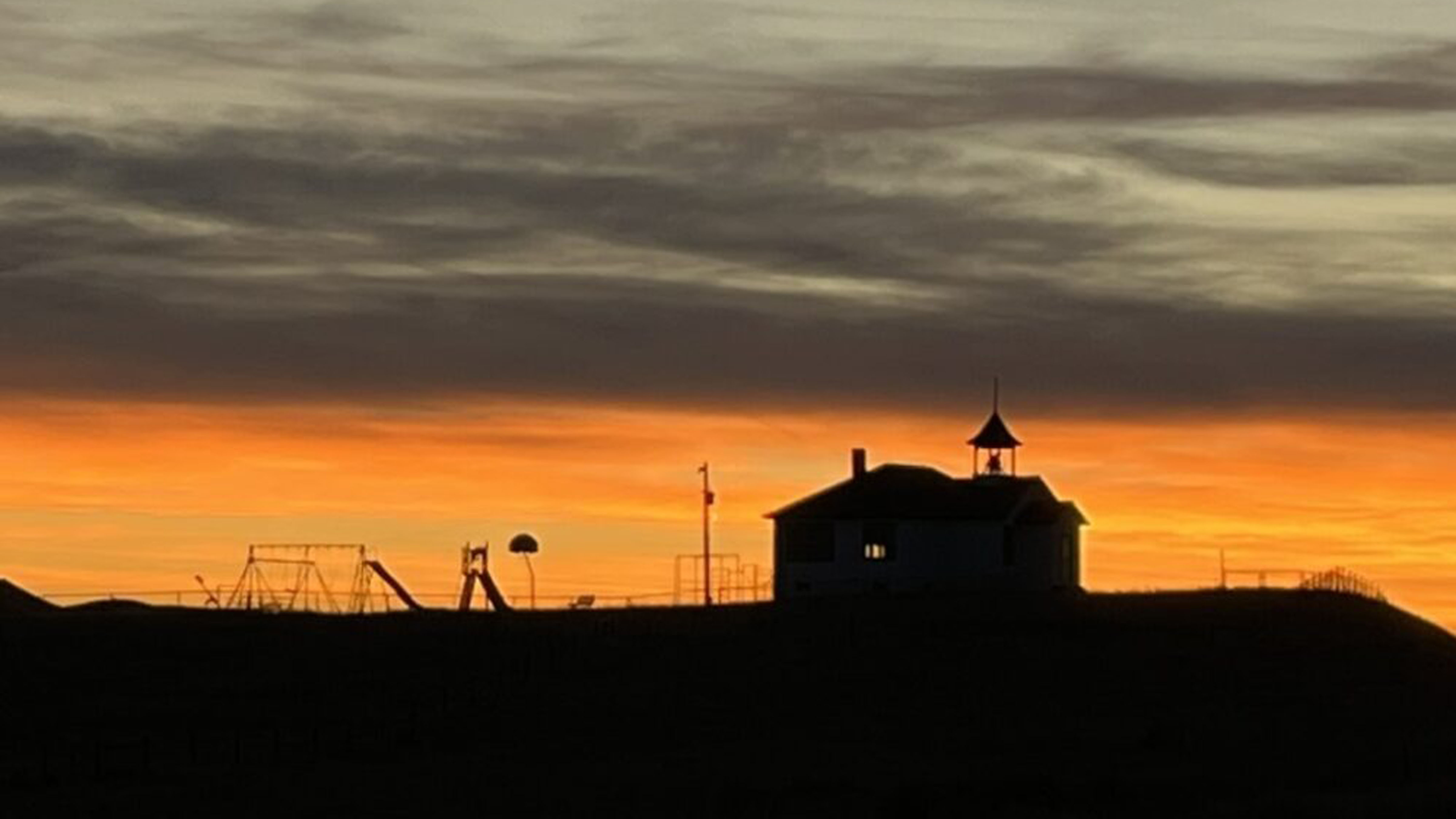 "Hwy 18-20 with Shawnee country school silhouetted."