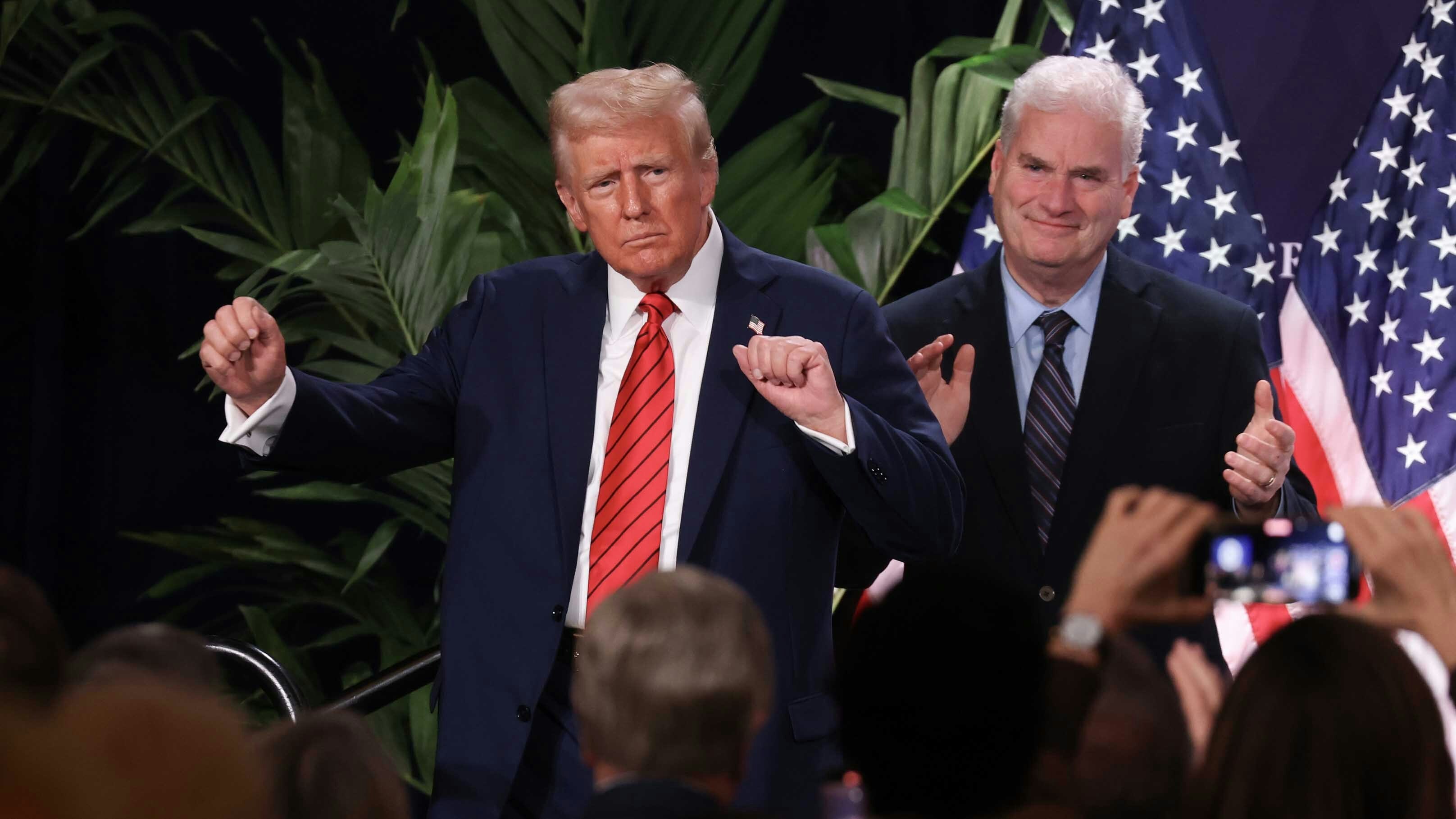 U.S. President Donald Trump dances as House Majority Whip Tom Emmer (R-MN) applauds following Trump's speech.