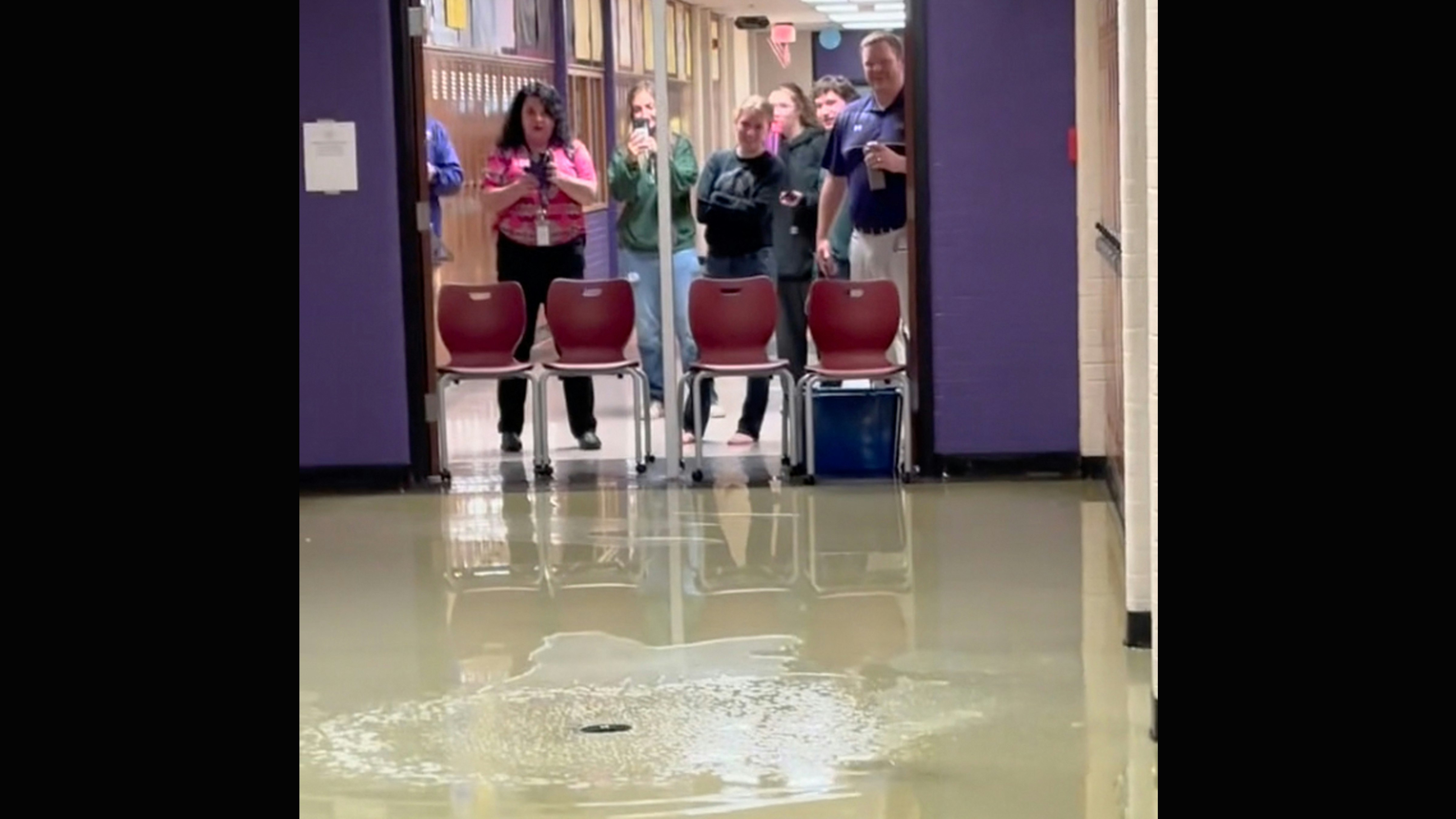 Campbell County High School students filming water leaks in high school