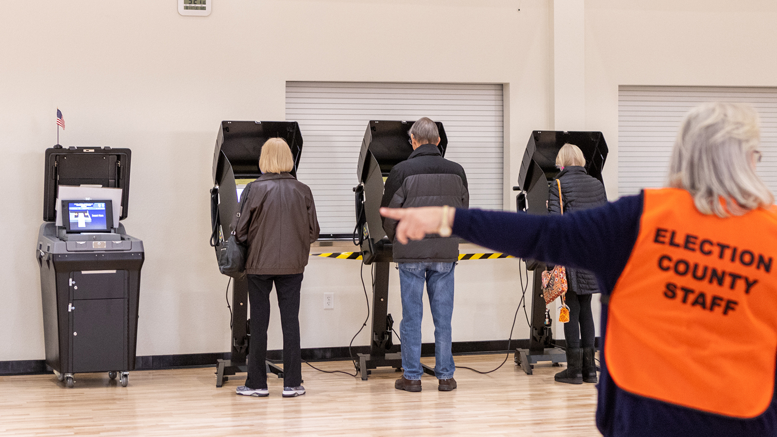 A Laramie County elections staffer directs voters during the 2022 general election in Cheyenne.