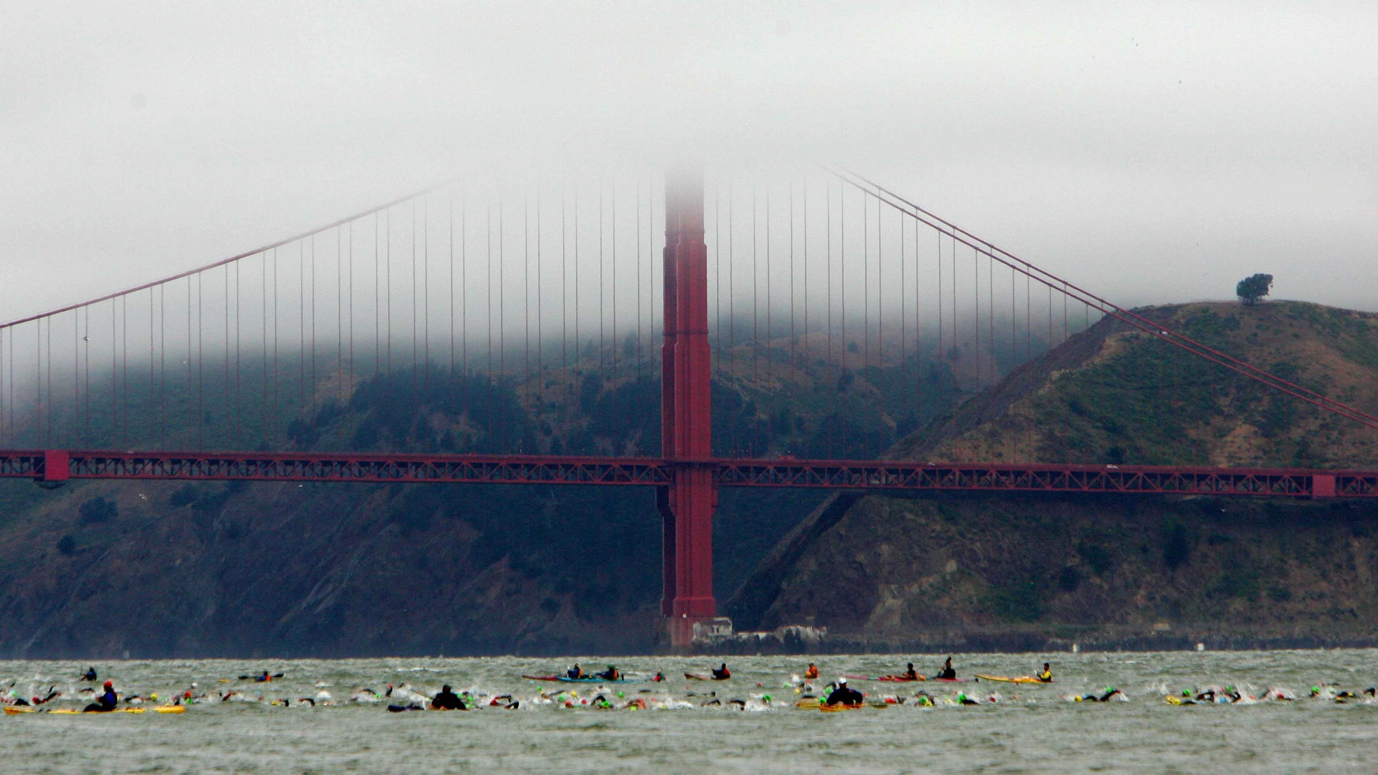 Athletes swim in the San Francisco Bay during the Escape from Alcatraz Triathlon