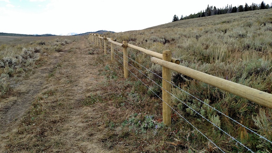 This section of “wildlife-friendly” fence in the Pinedale region was designed by the Wyoming Game and Fish Department to make it easier for wildlife to get over or under it.