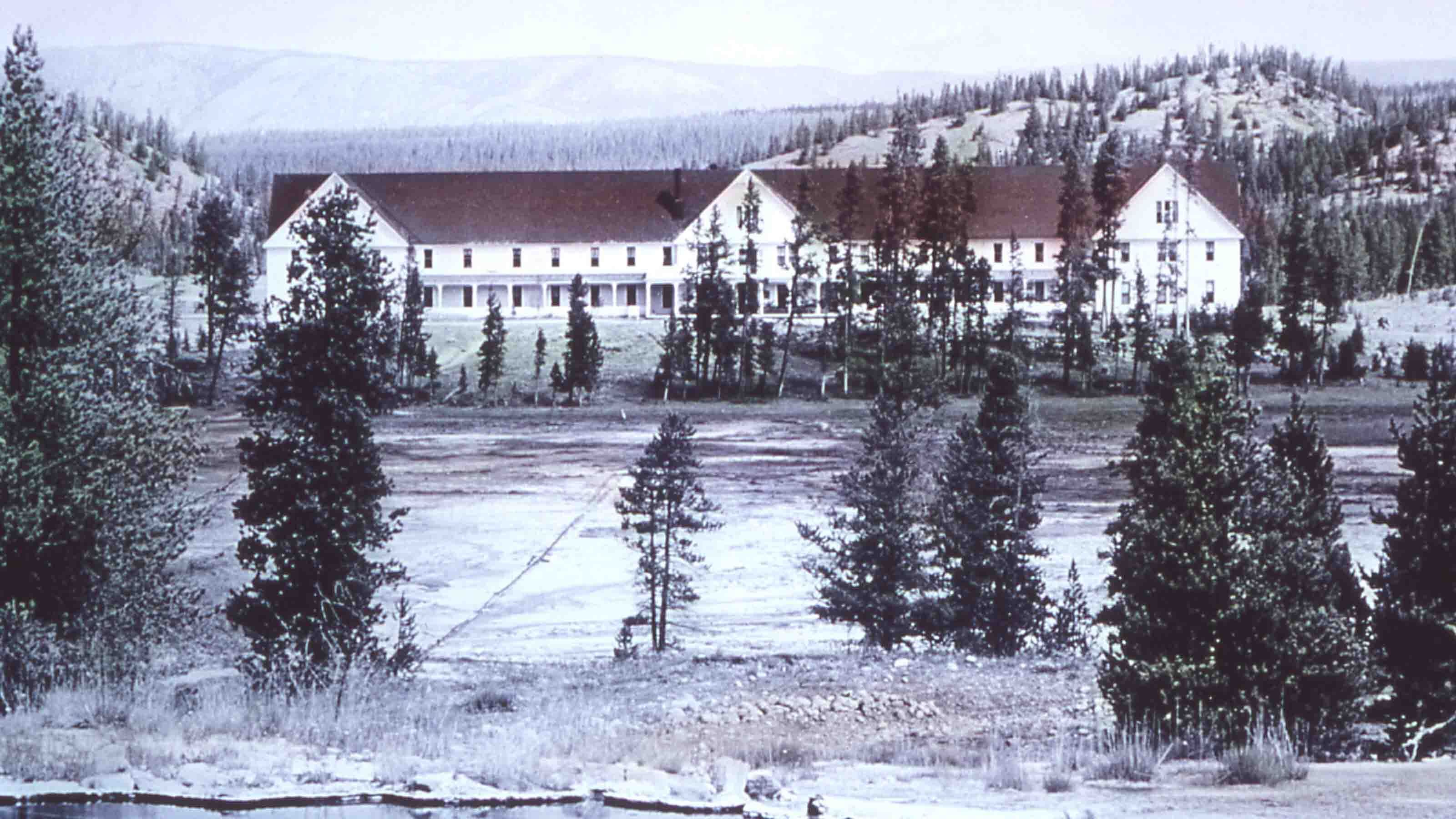 The Fountain Hotel with Leather Pool in the foreground and the hot water pipe visible in the meadow.
