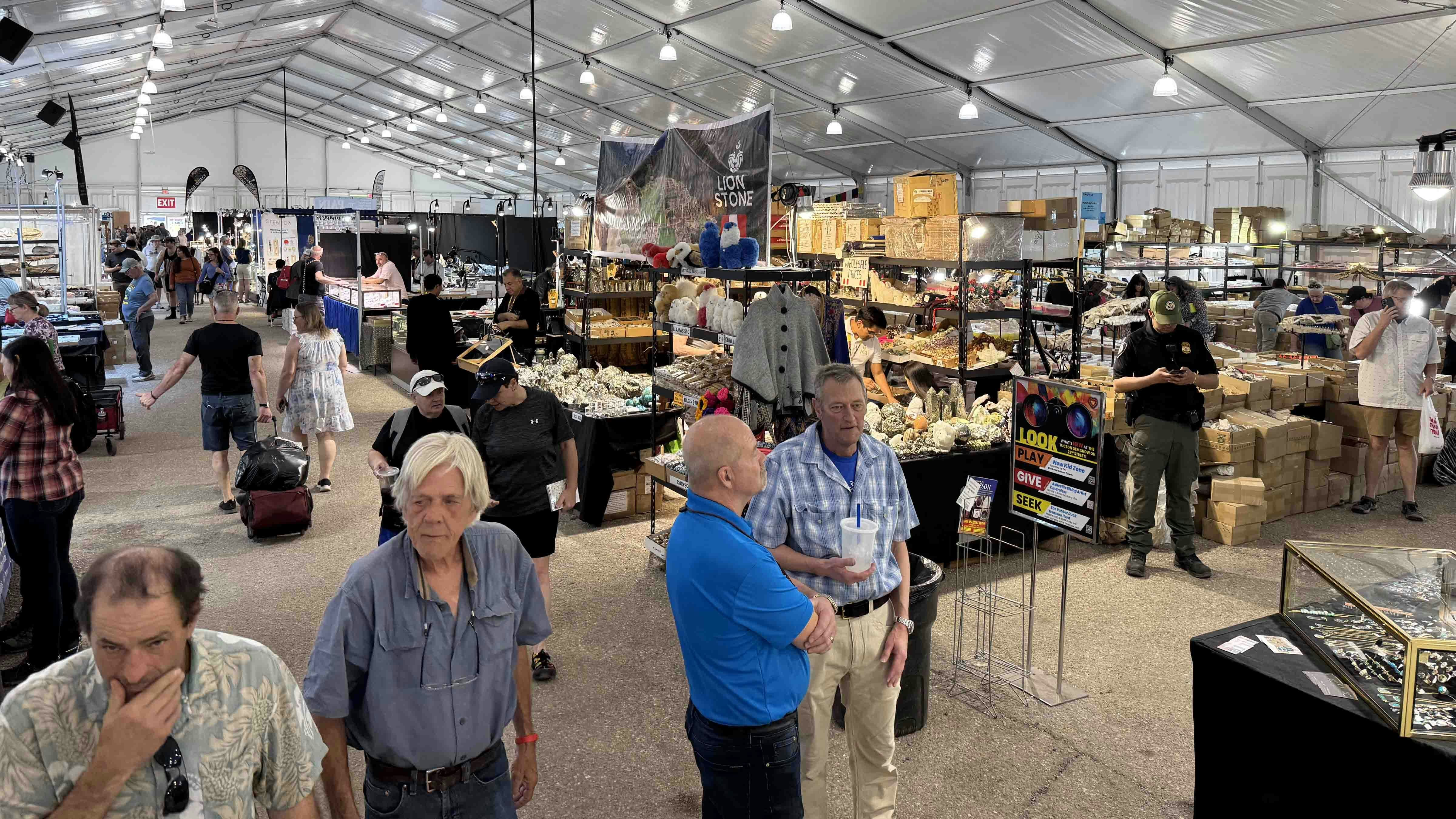 Inside the massive tent set up for the 22nd Street Mineral, Fossil, and Gem Show during the 2025 Tucson Gem and Mineral Show.