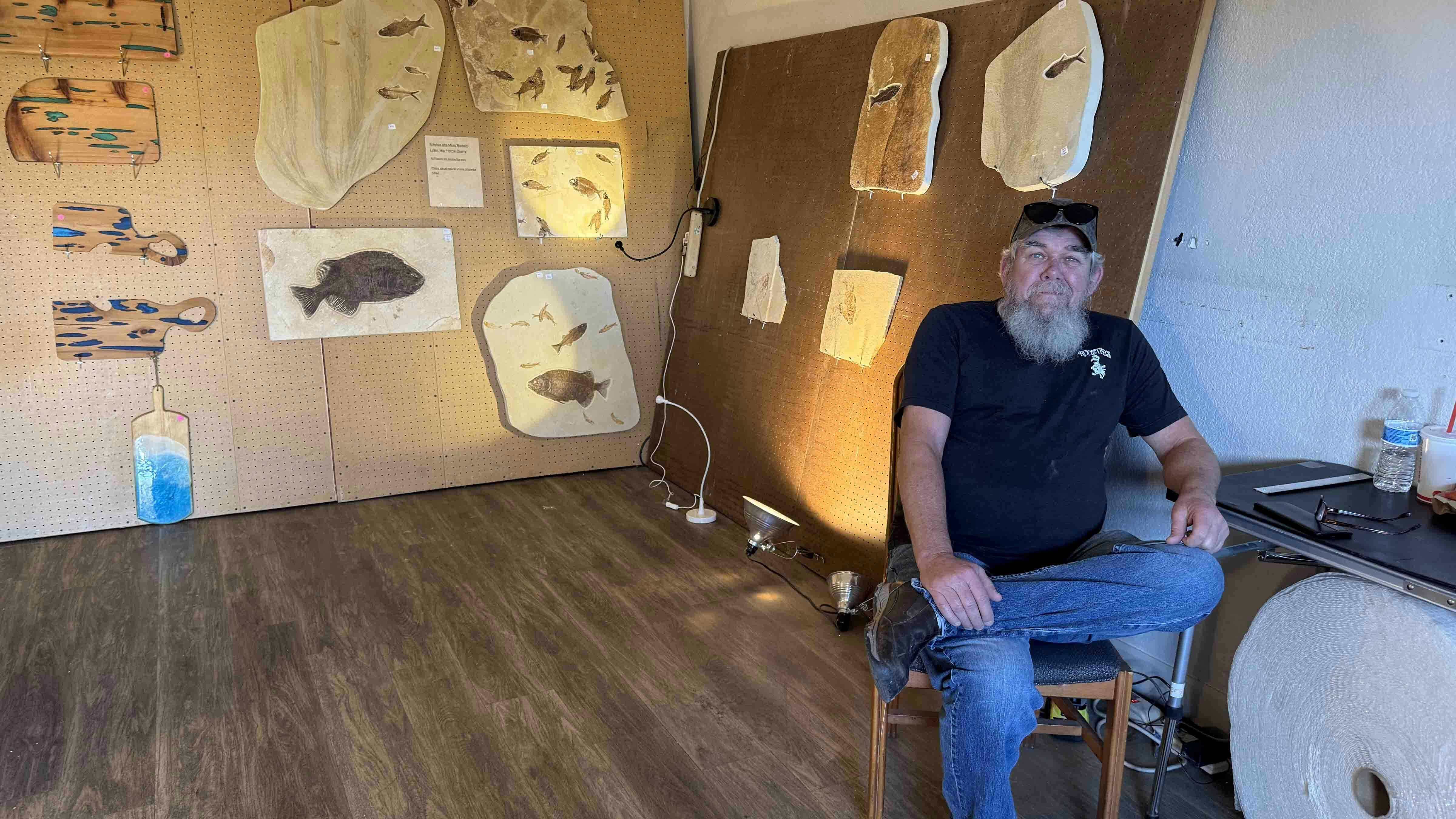 Terry Rickers in the Dempsey Ridge Room during the 2025 Tucson Gem and Mineral Show. Fossil fish from the Green River Formation near Kemmerer have been sold out of this room for 20 years.