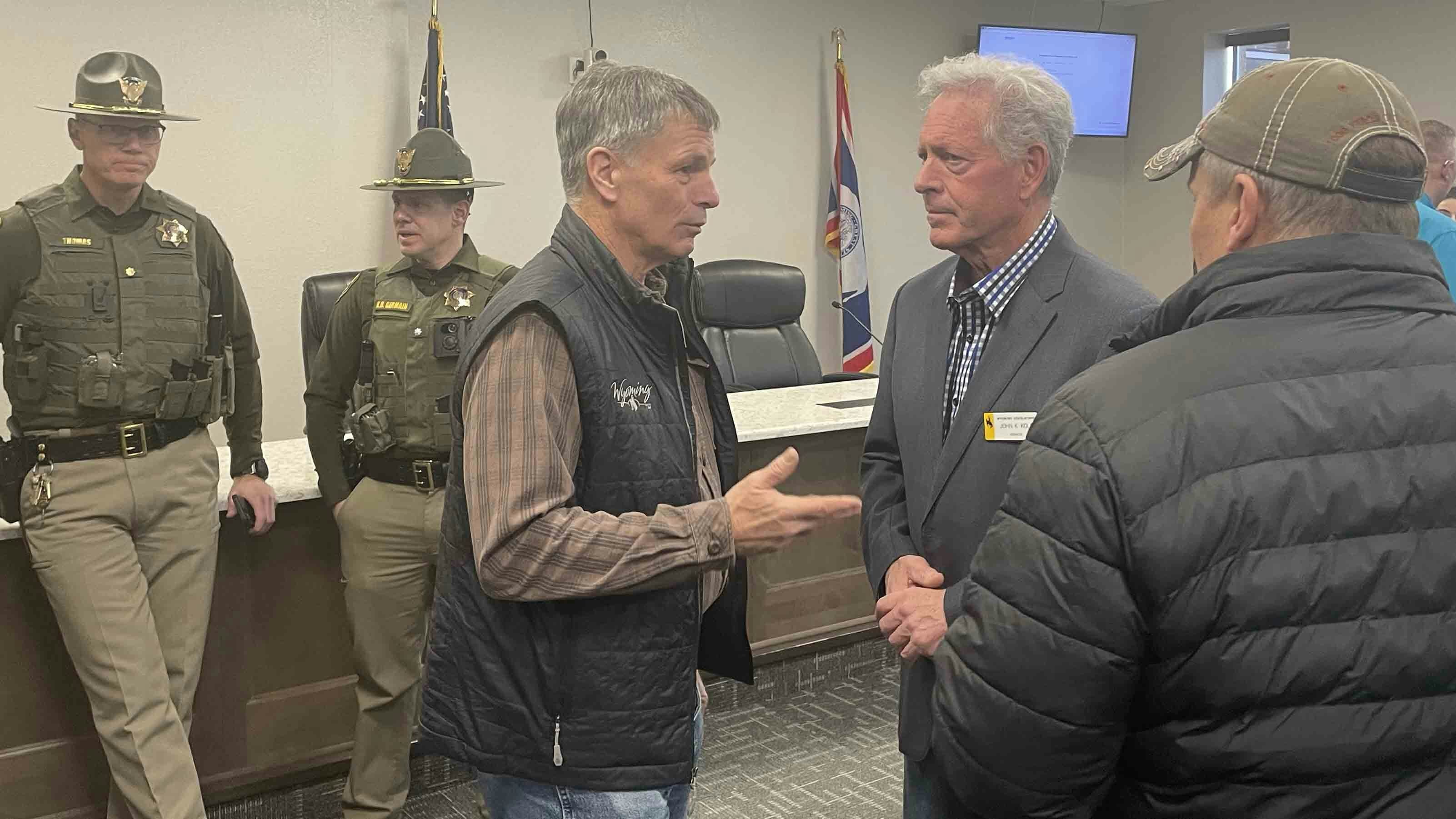 Gov. Mark Gordon speaks to state Sen. John Kolb following a press conference on the Green River tunnel