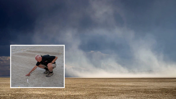 Kevin Perry, Professor of Atmospheric Sciences at the University of Utah, examines a dust mitigation test site on the exposed lakebed of Farmington Bay in Utah's Great Salt Lake on July 9, 2025. As water levels drop in Utah's Great Salt Lake, scientists are urgently working to understand the dust coming off the exposed lakebed and its potential health risks to the communities nearby.