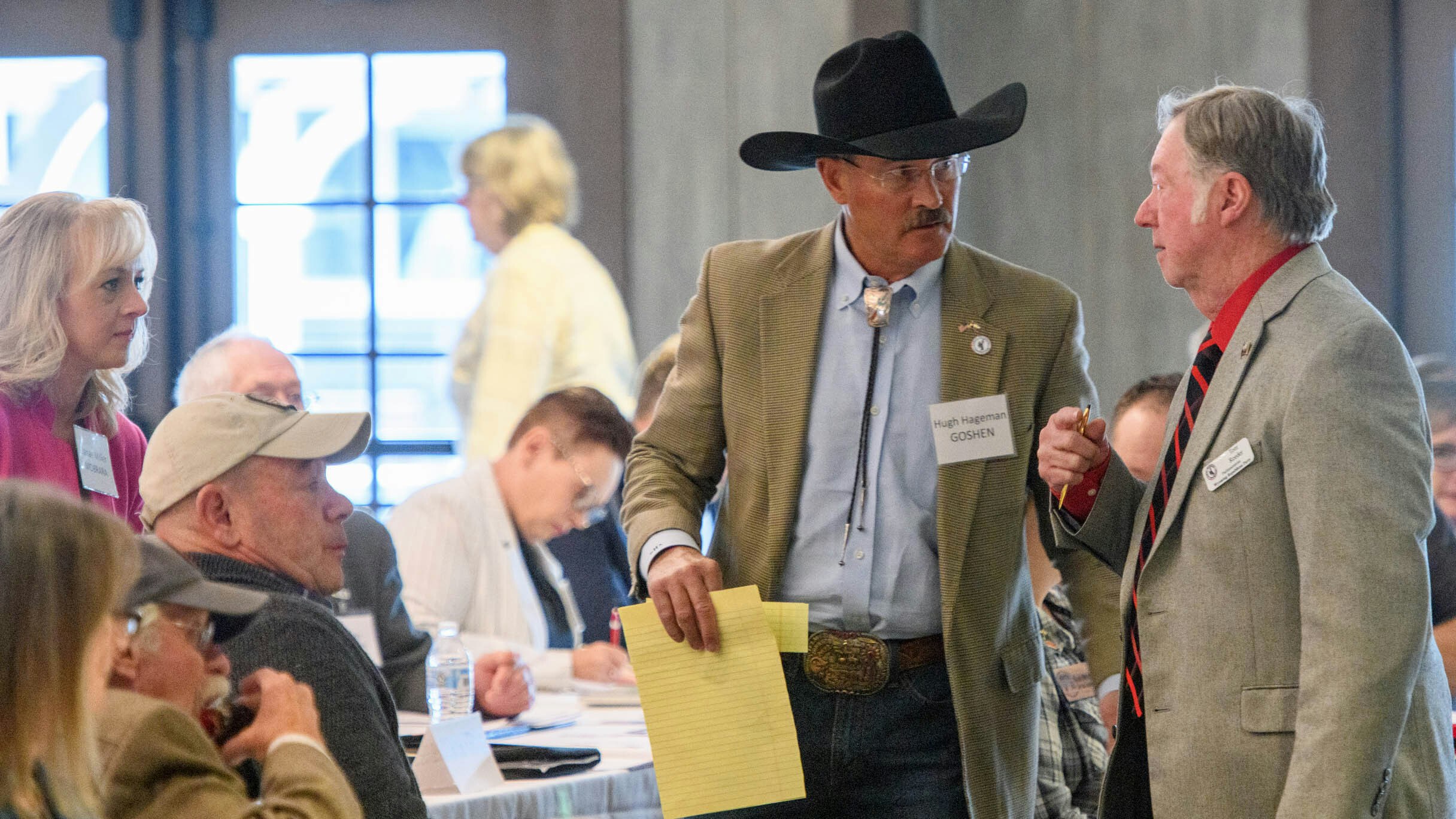 Goshen County Republican official Hugh Hageman talks to former Wyoming State Rep. Tom Reeder.