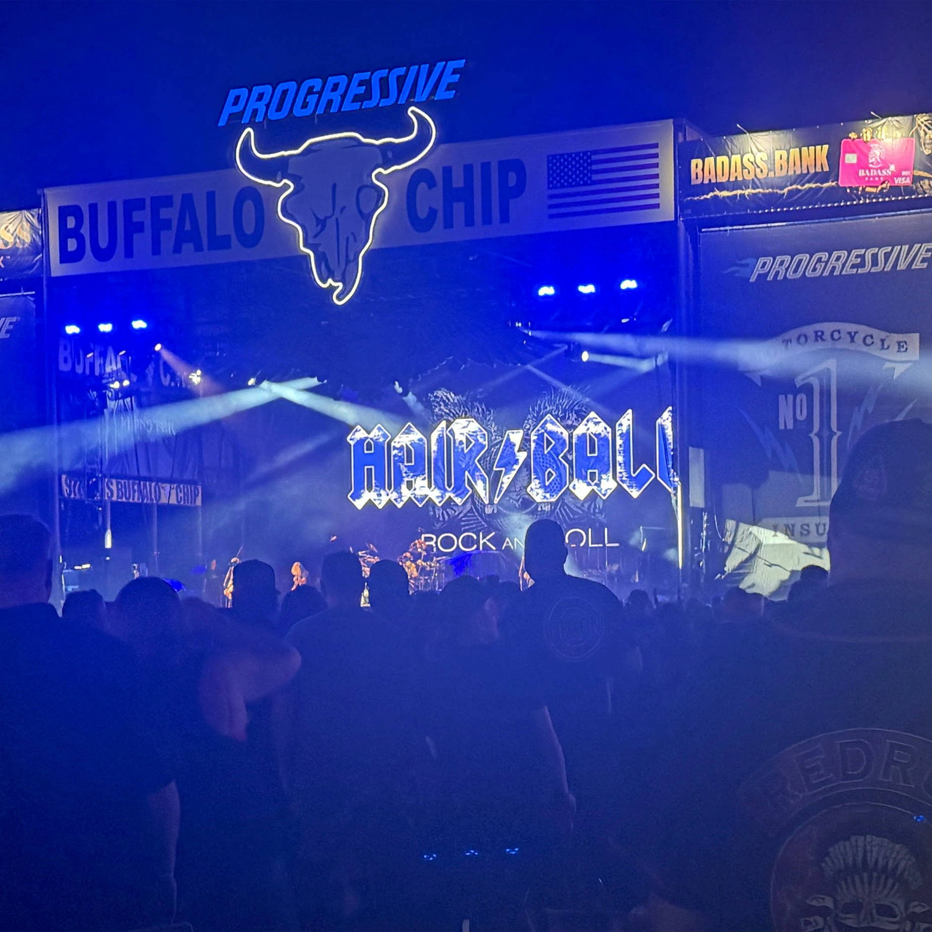 A crowd packs the Buffalo Chip after dark as Hairball takes the stage during the Sturgis Motorcycle Rally.
