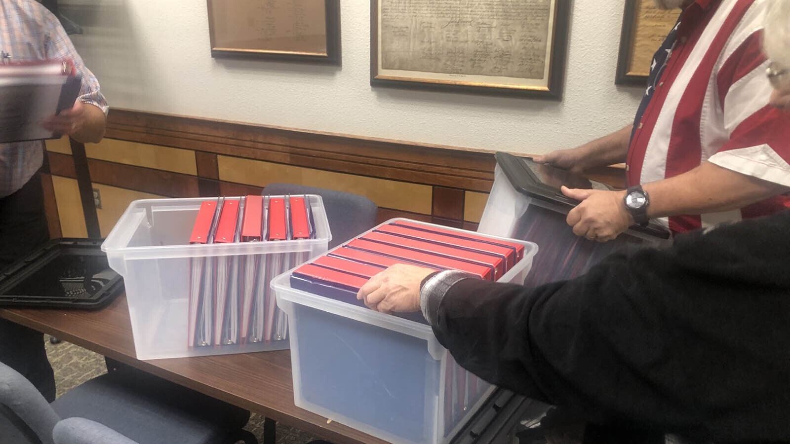 Binders to tally votes during a hand-count ballot test in Gillette.