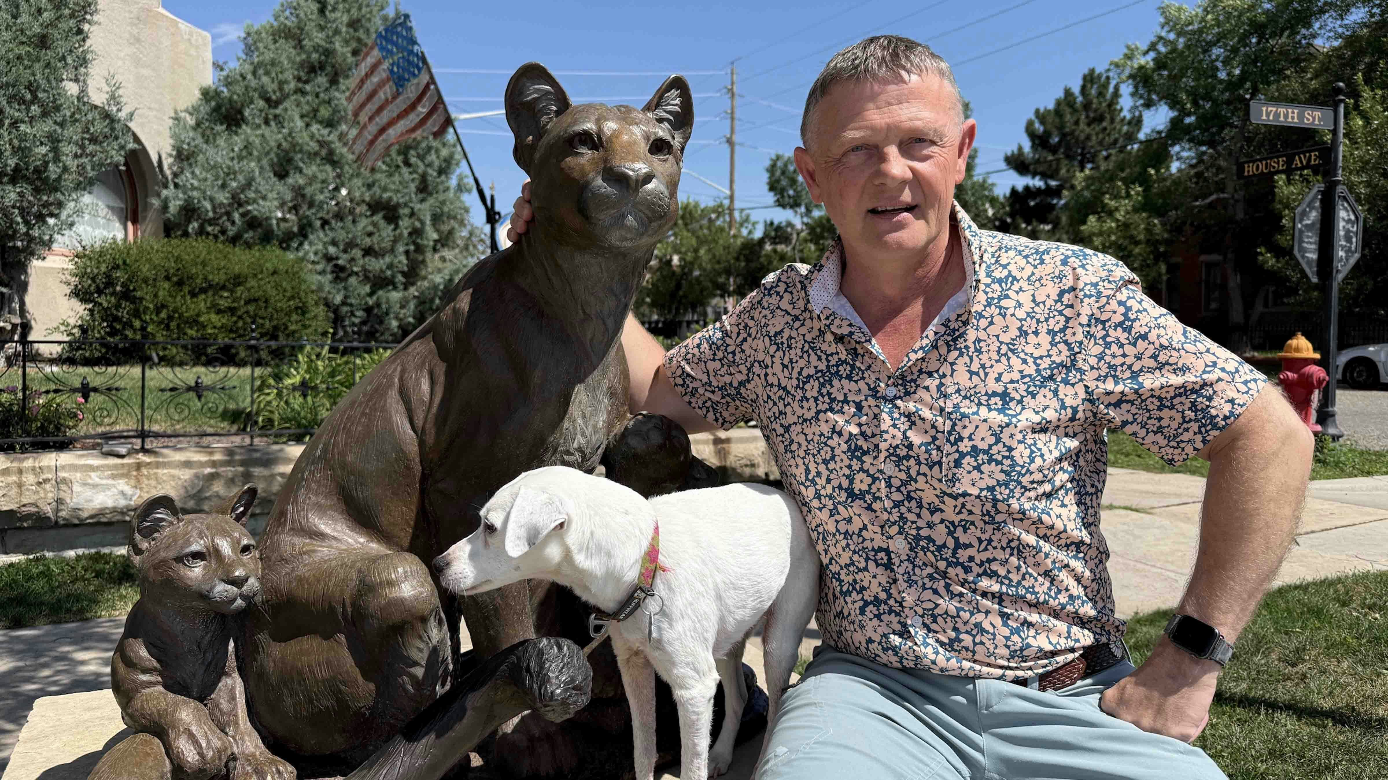 Harvey Deselms, and his dog Dot, with one of the bronze sculptures for the Capital Avenue Bronze Project