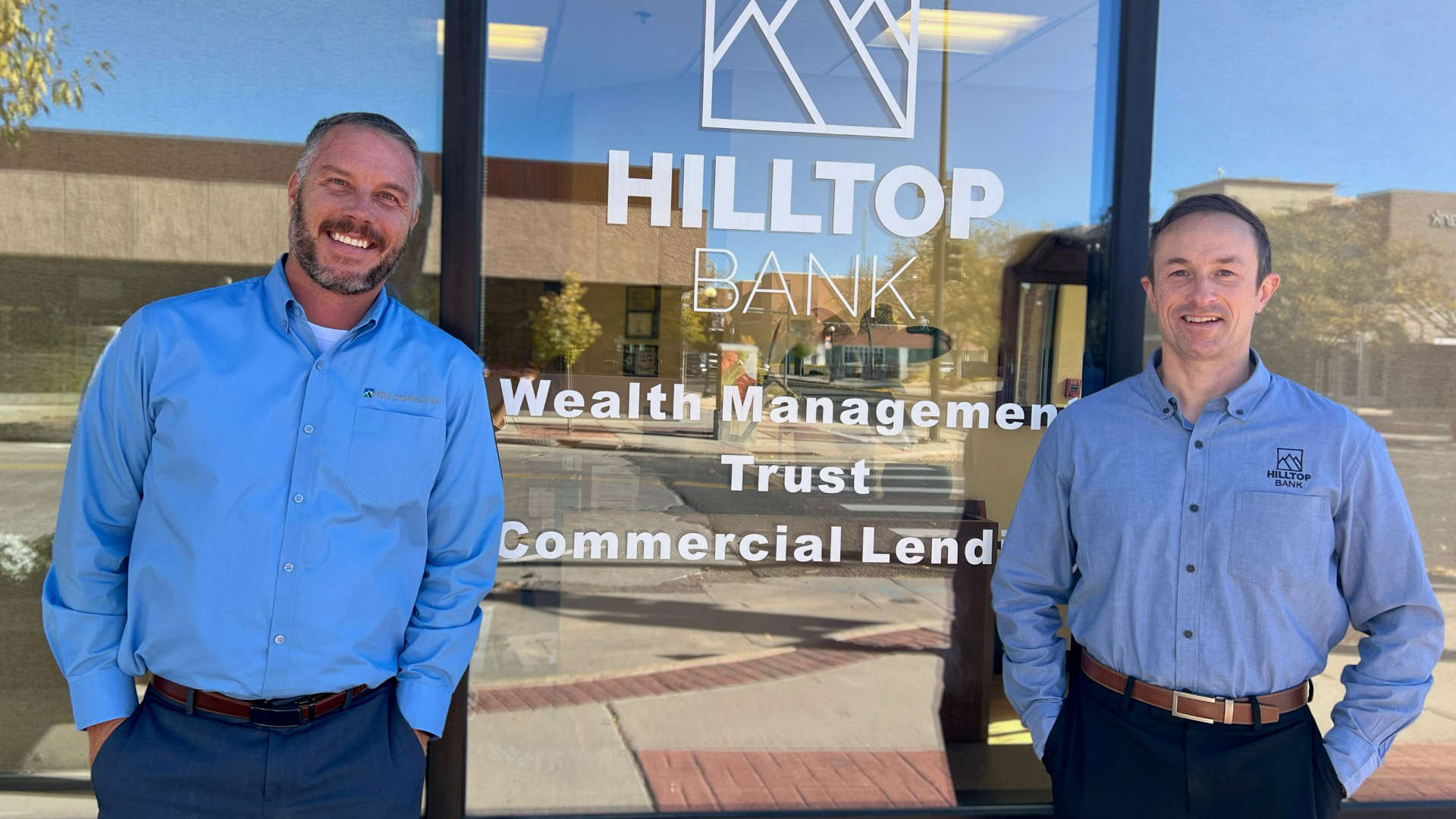 John Hardee and Sean Michaels stand outside the Hilltop Bank branch in Cheyenne, Wyoming.