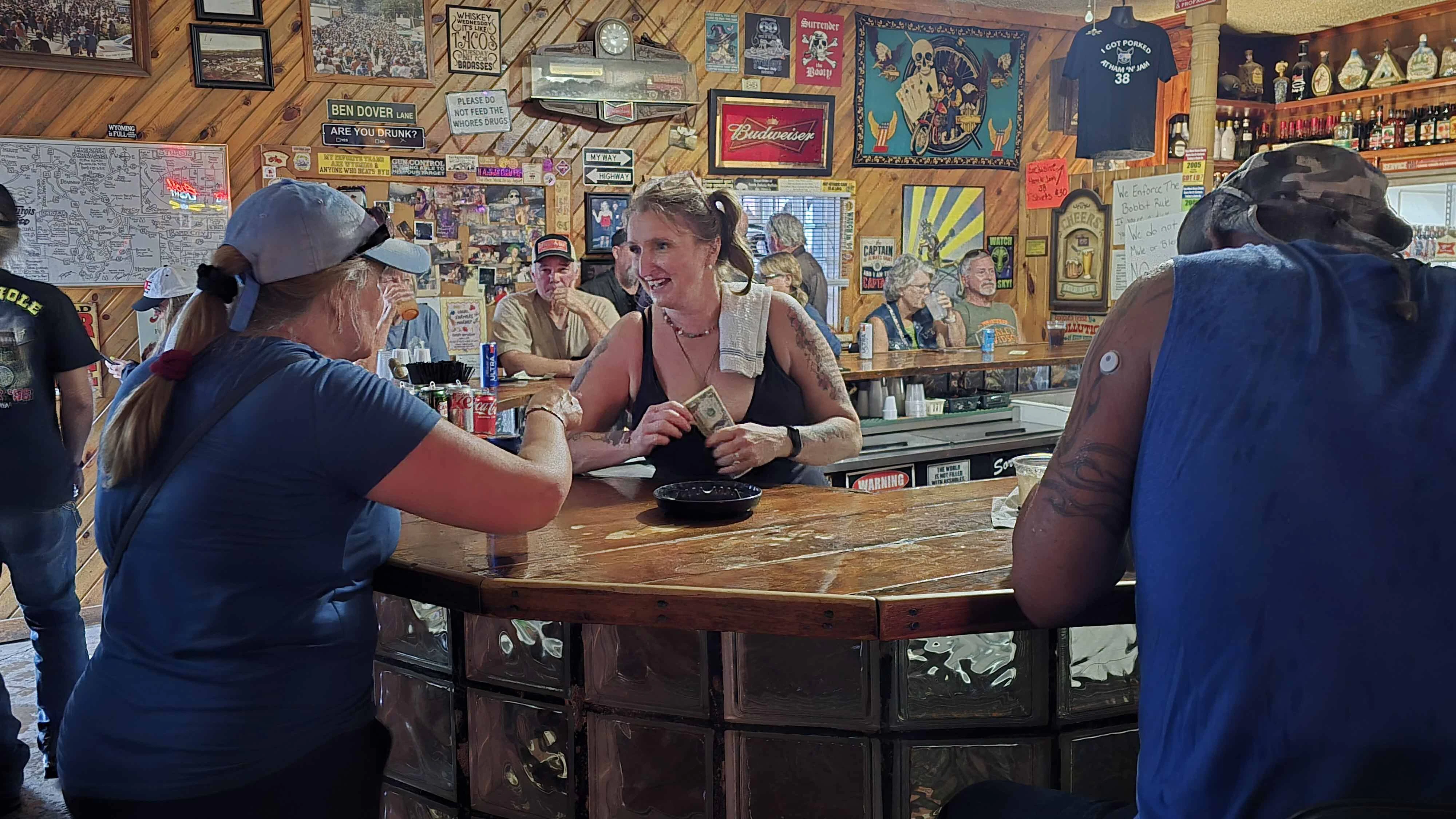 Kelly Maher-Wolfensperger chats with a customer just before the Hulett Ham and Jam started.