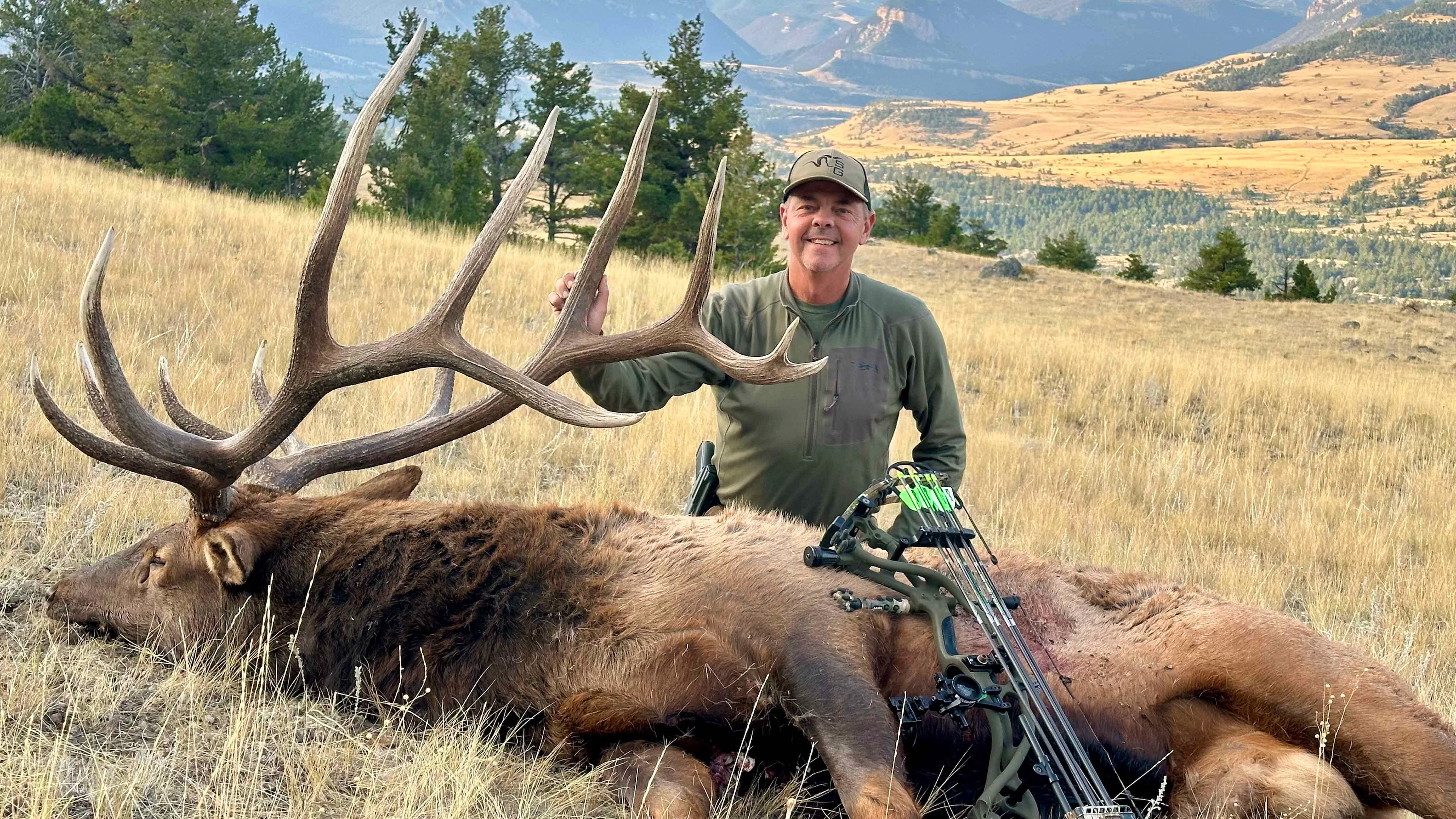 Bowhunter Ron Niziolek poses with a bull he shot Sept. 19, 2025, and returned the next morning to find it had been partly eaten by a grizzly.