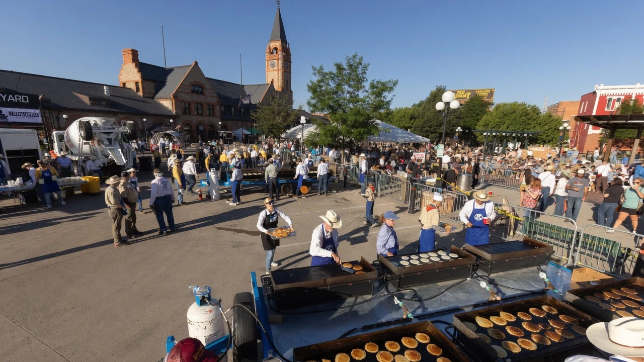 Pancakes fly at the Cheyenne Frontier Days Pancake Breakfast in downtown Cheyenne on Monday, July 20.