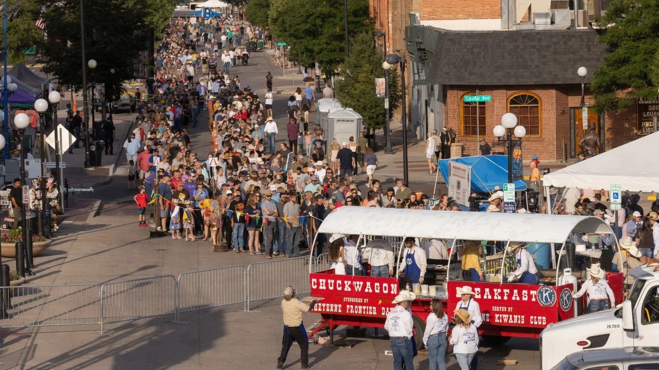 Crowds of people line up for the free Cheyenne Frontier Days Pancake Breakfast in downtown Cheyenne on Cheyenne Day on Wednesday, July 22.