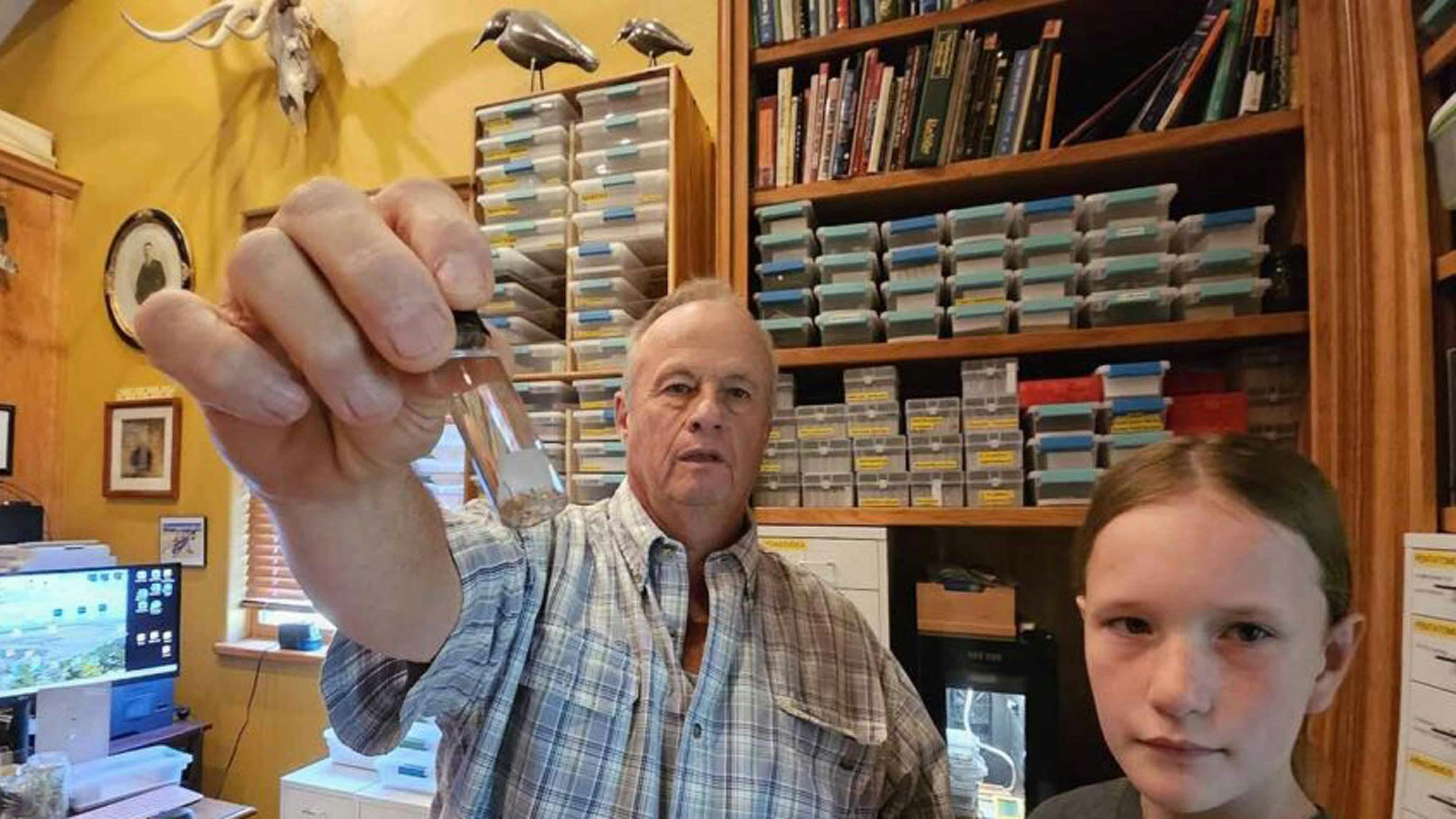 Many of the insects Aaron Clark finds on his ranch with the help of Allie Hazen are very small. The vial Clark is holding up contains a dozen or so specimens.