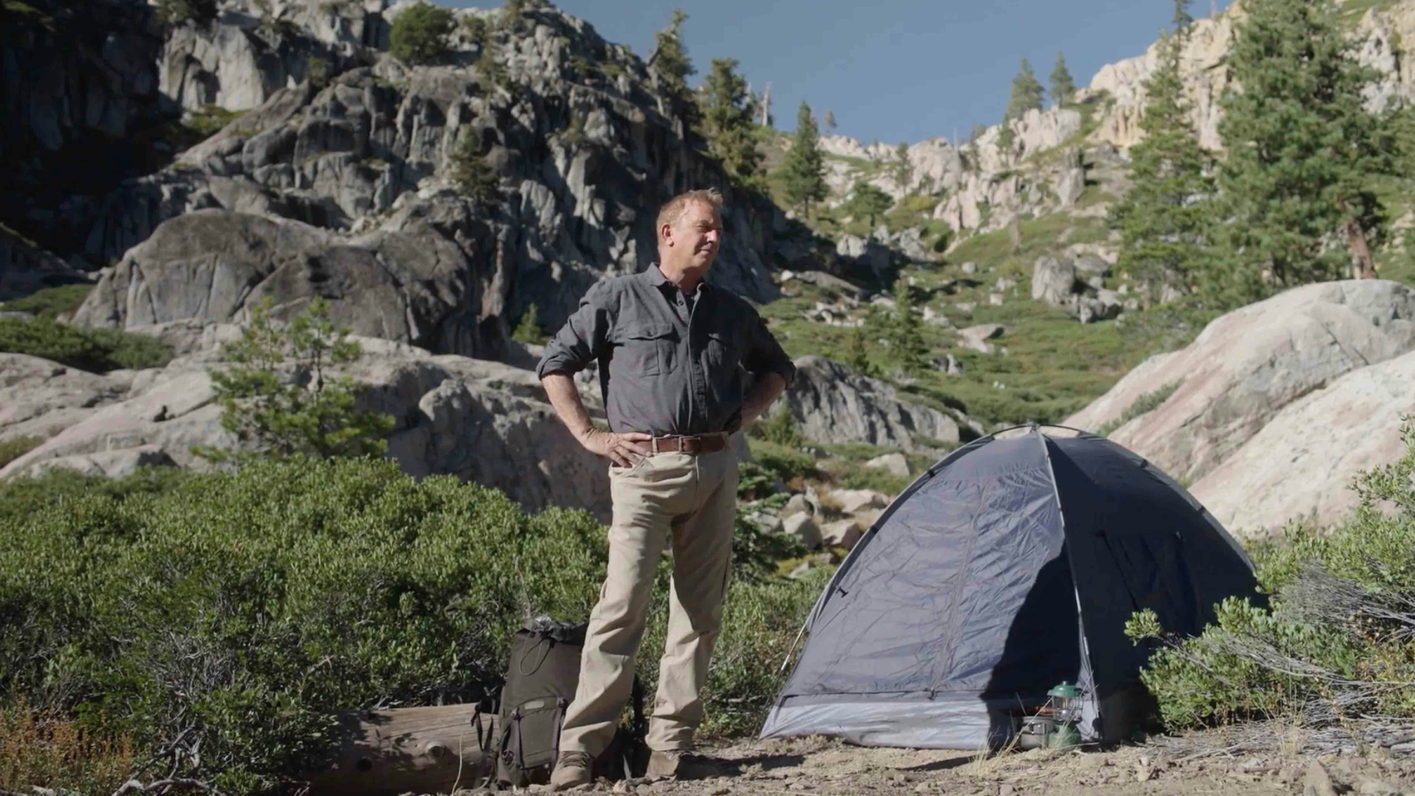 Kevin Costner standing in what he figures to be one of the same campsites used by President Teddy Roosevelt and John Muir in 1903.