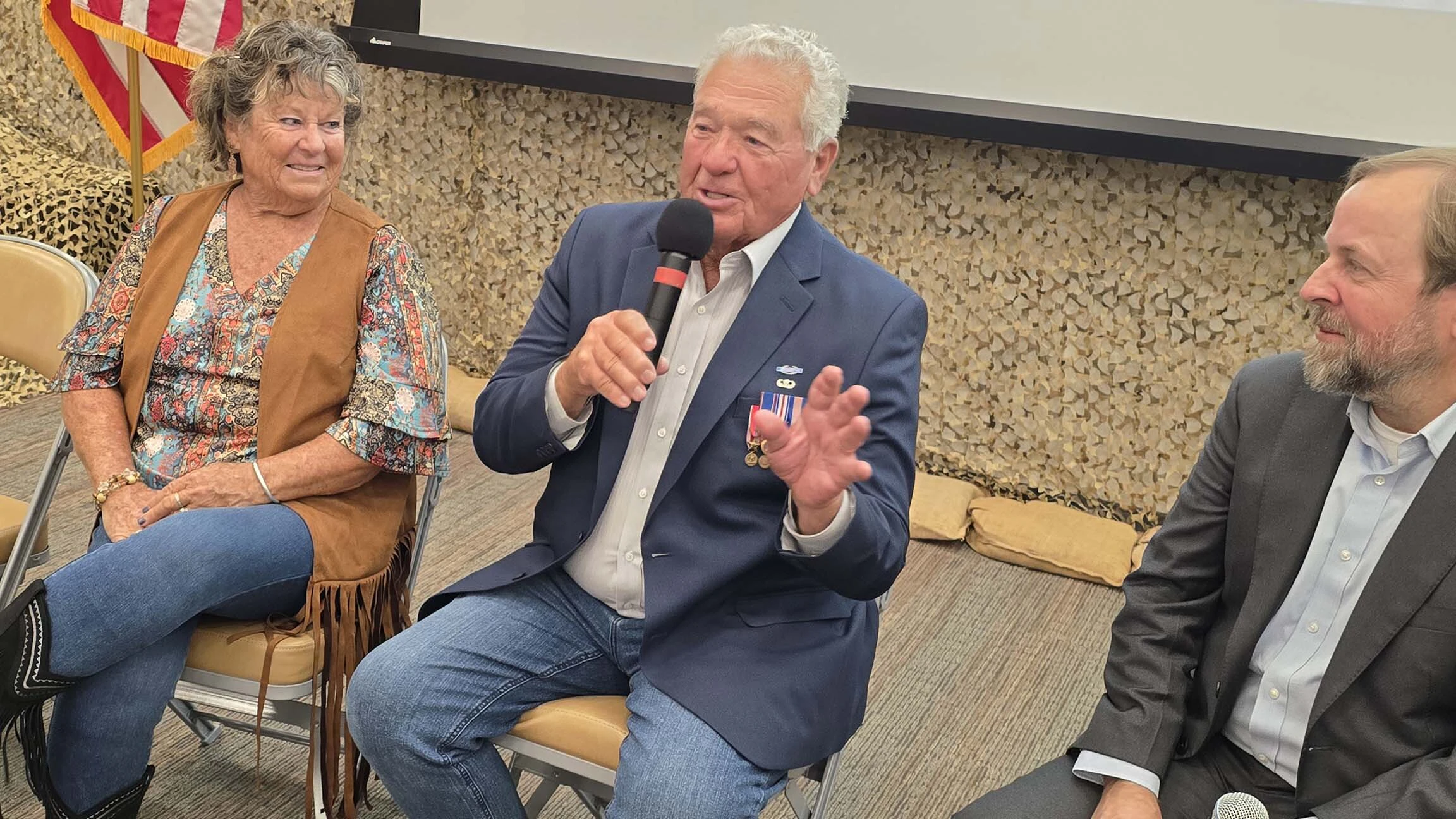 Vietnam veteran Lee Alley, center, talks about his journey back to Vietnam during a panel about the PBS Documentary, "Home from the Vietnam War."