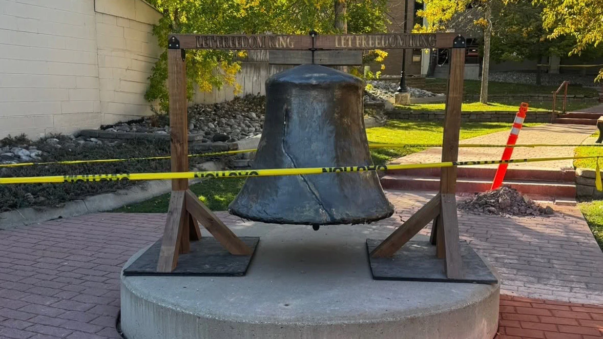The Liberty Bell in the courtyard of the Campbell County Courthouse. The bell is made of wood, chicken wire, and papier-mâché on a wooden frame, and nobody knew how it got there until Gillette Main Street admitted that it was a gift for America's 250th anniversary.