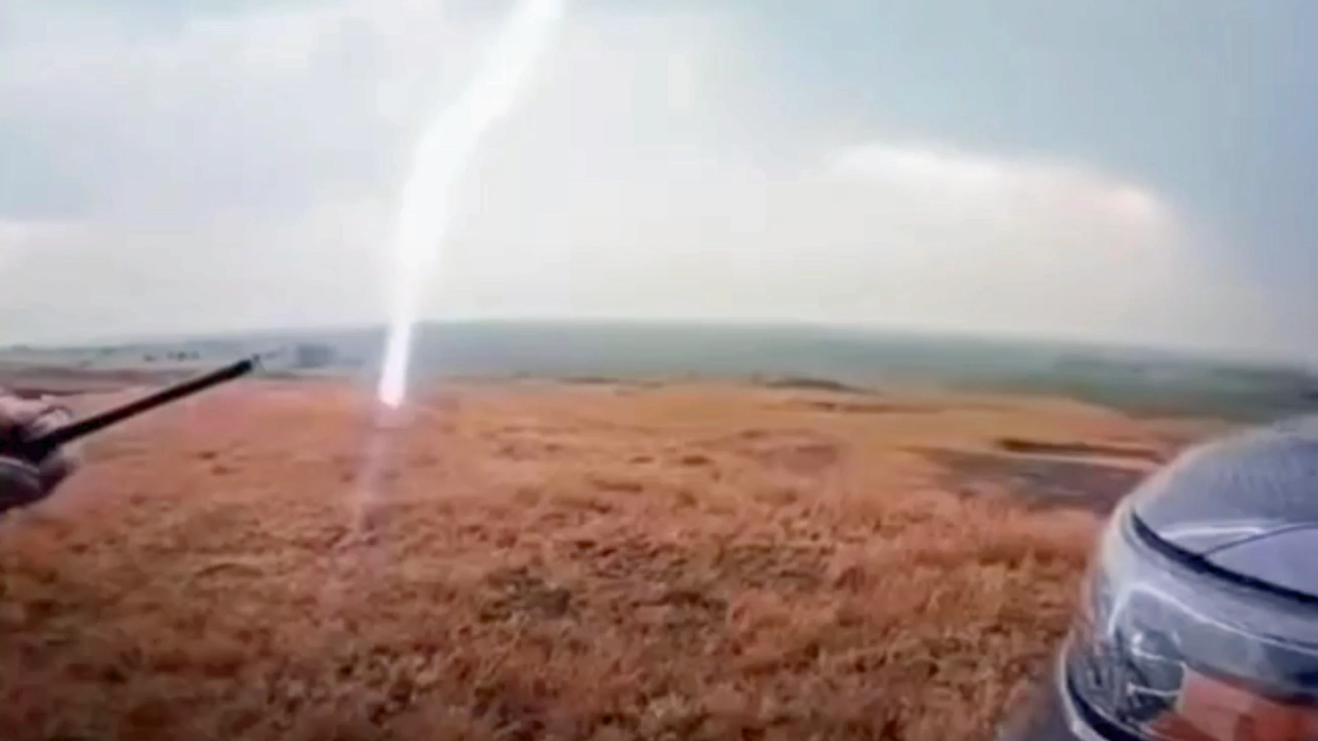 Screenshot of a lightning strike that came within 50-feet of two South Dakota Highway Patrolman on Wednesday.