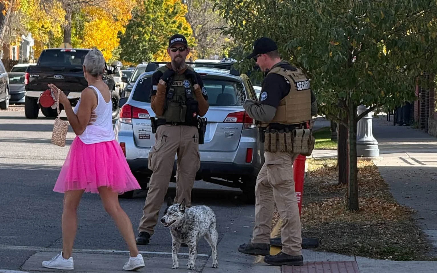 Livingston actor Quenby Iandiorio, wearing a pink tutu, walks past Livingston police while protesting the filming of a Daily Wire movie.
