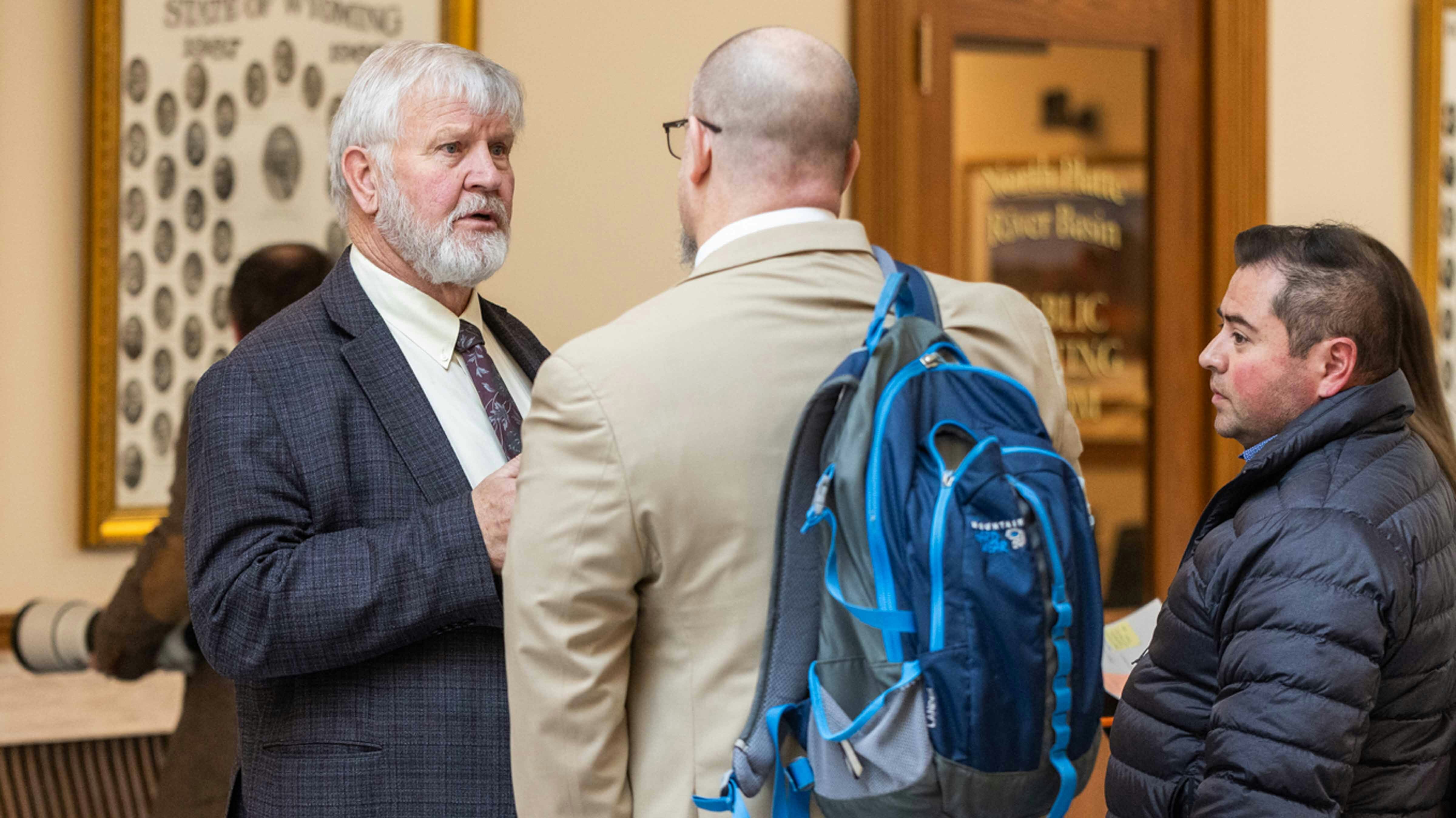 Rep  Lloyd Larsen talks with bill supporters after the House Transportation Committee Meeting on Bill HB0032 - English Proficiency-Commercial Motor Vehicle Drivers