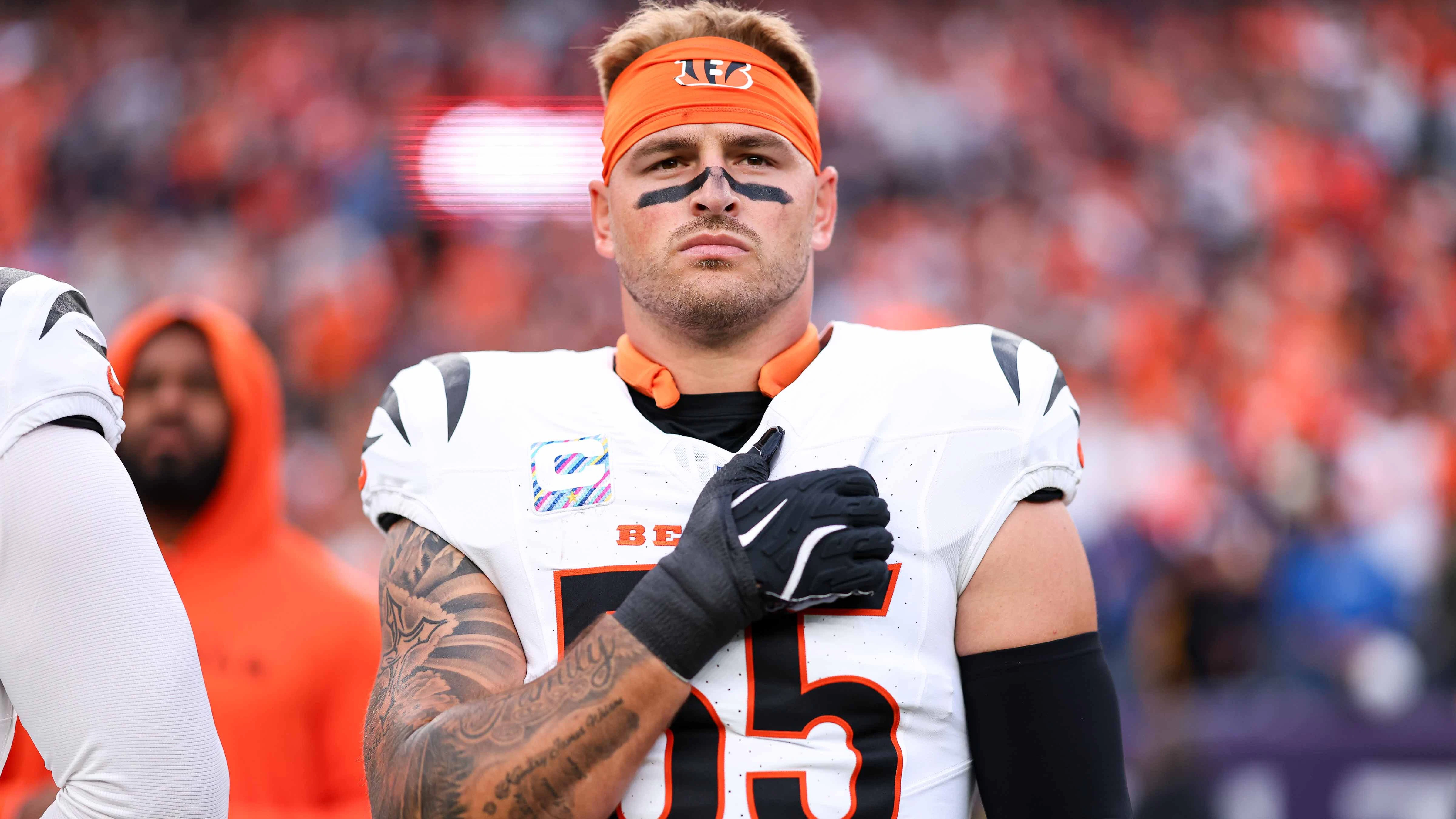 Logan Wilson #55 of the Cincinnati Bengals stands on the sideline during the national anthem prior to the game against the Denver Broncos at Empower Field at Mile High on September 29, 2025 in Denver, Colorado.