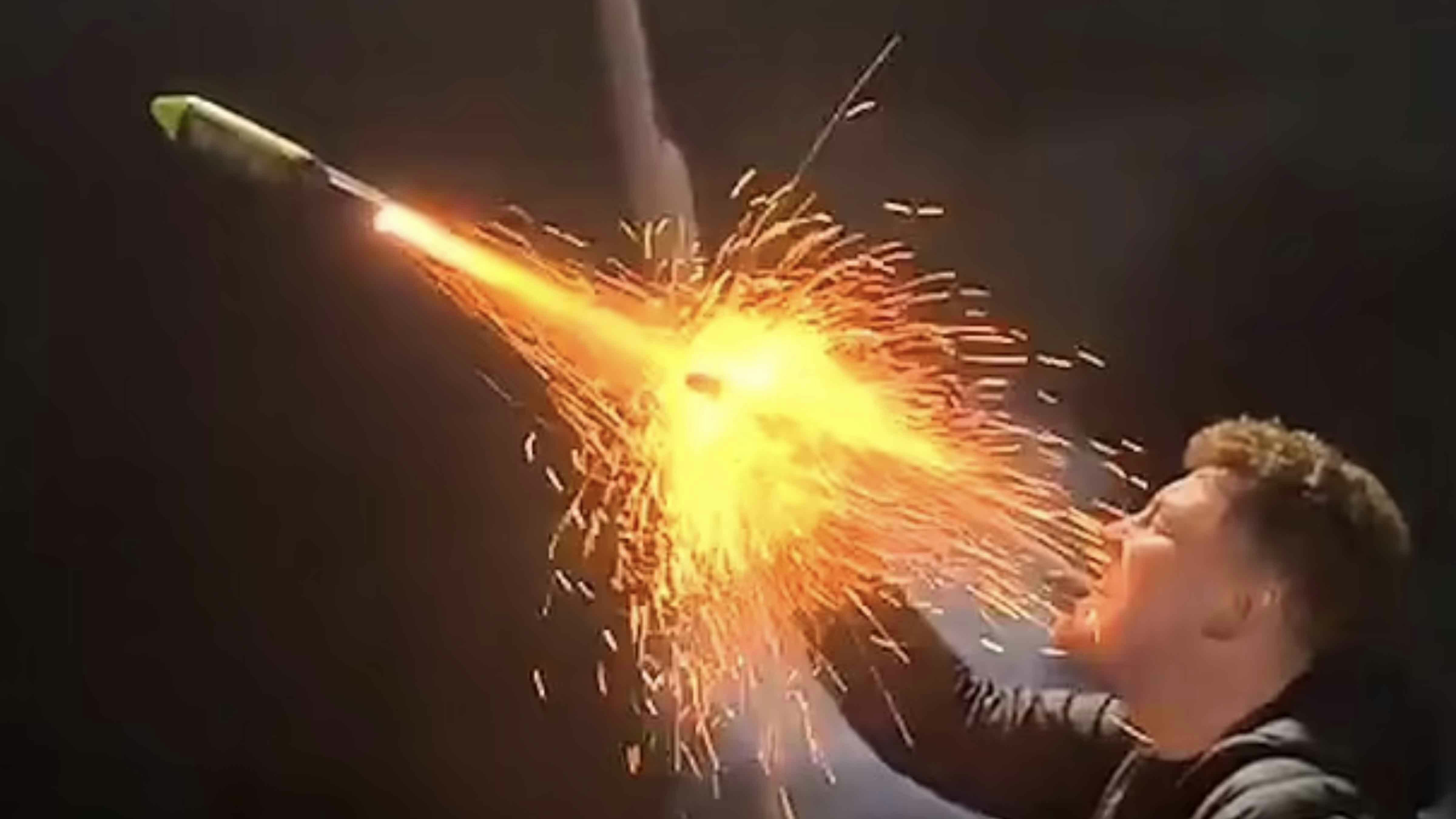 Man shooting fireworks from his mouth.