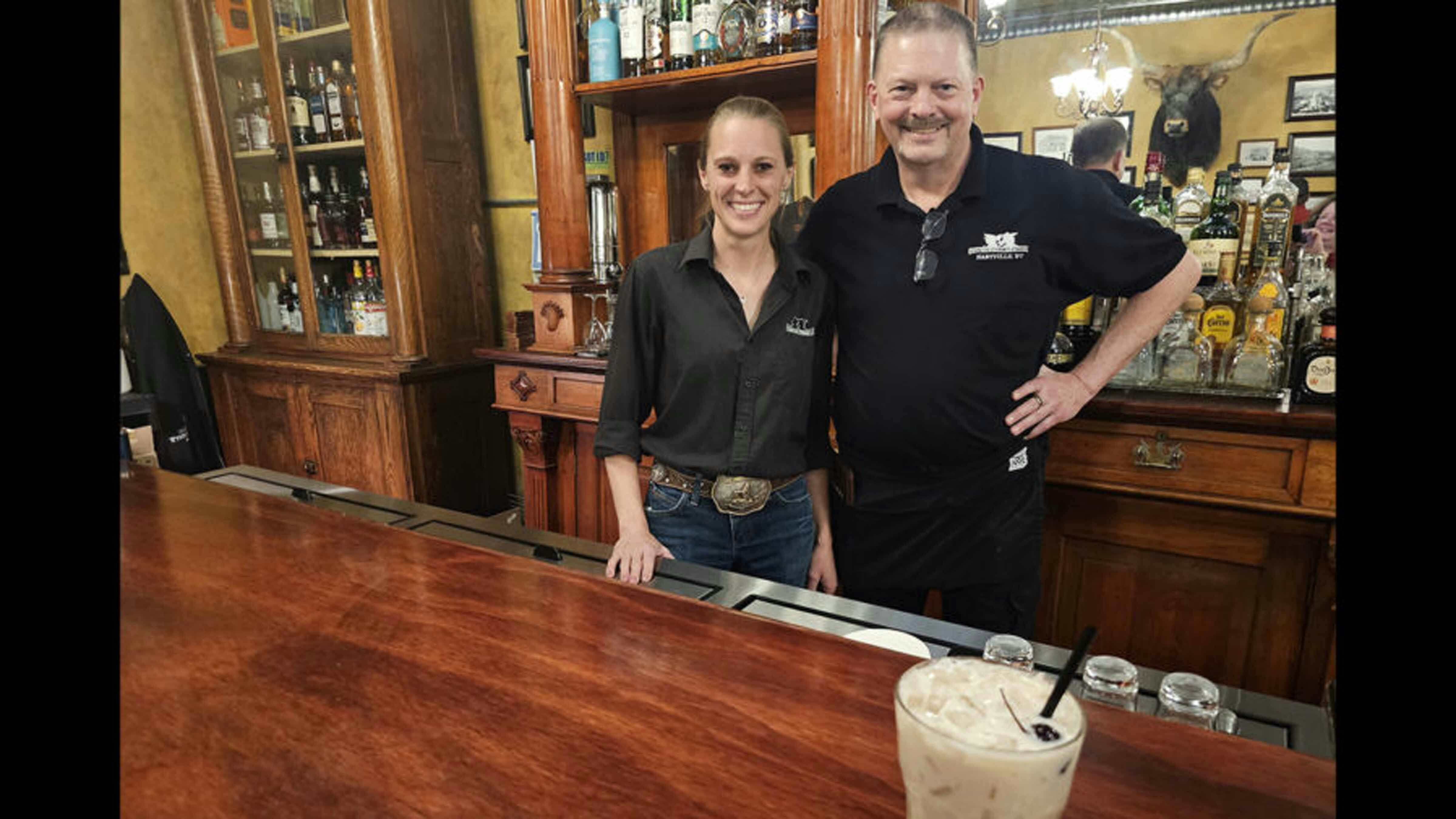 Jessica Walker, left, and Michael Thompson, right, helped finish the cocktail their coworker Melissa Anderson started right before she died. The Sweet Melissa, foreground, is a chokecherry brandy with cream, 7-Up, and amaretto served on the rocks with a Bordeaux cherry as garnish.