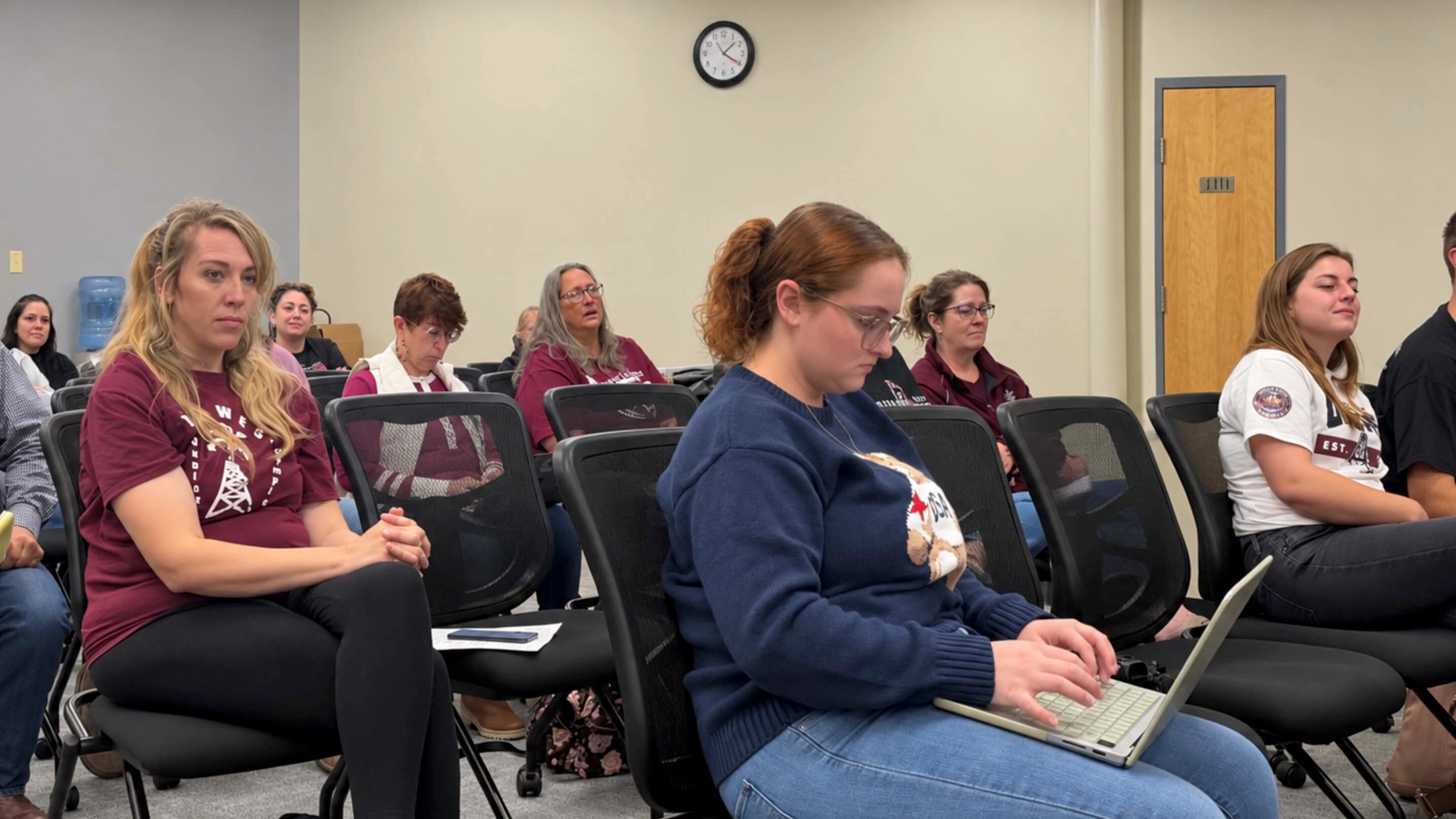 Attendees wearing Midwest shirts listen during Friday’s Natrona County School District infrastructure committee meeting in Casper. The committee unanimously voted to keep the Midwest closure proposal from advancing to the full school board.