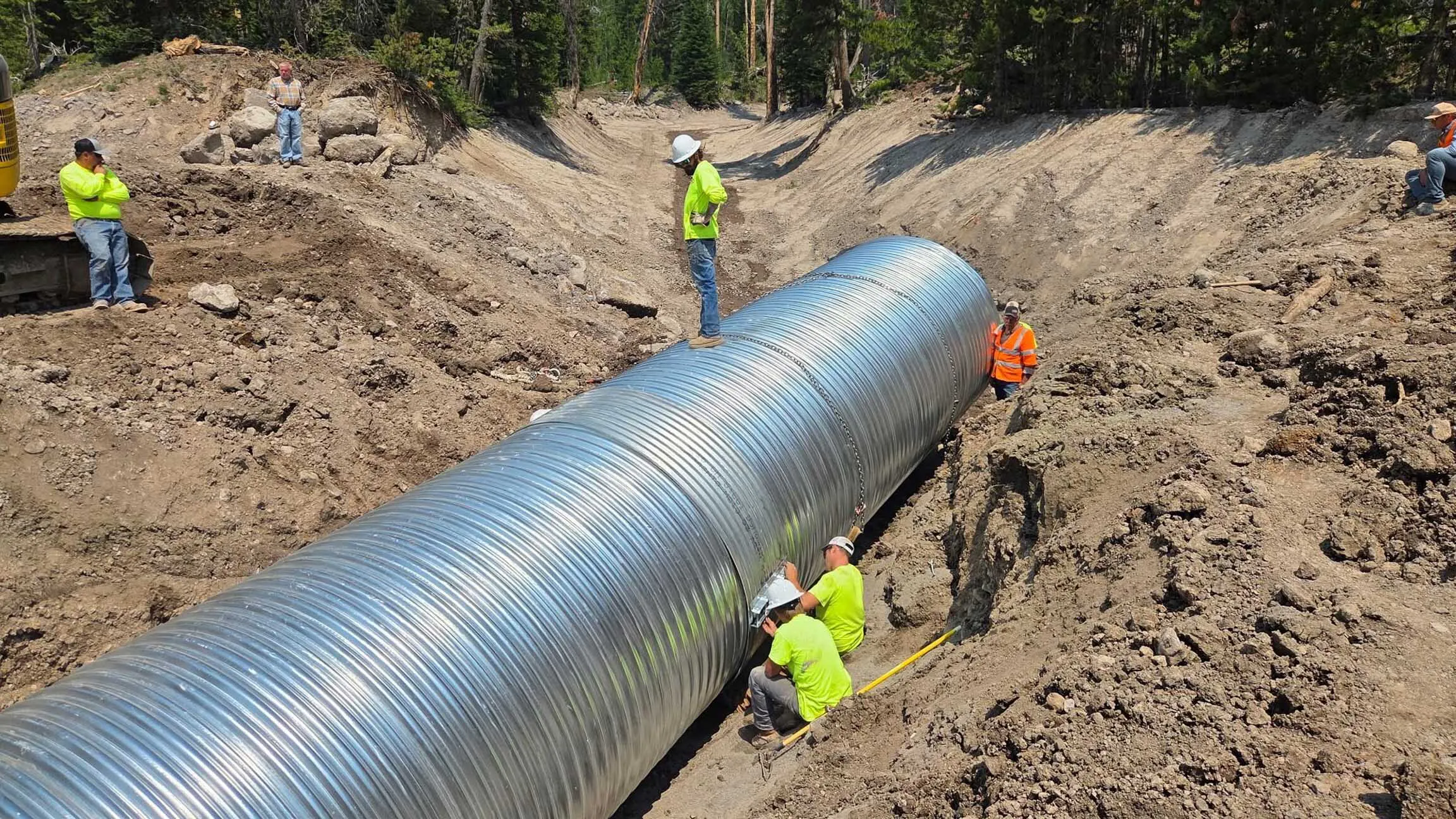 A new culvert being installed under the Brooks Lake Road in Shoshone National Forest. A July 22 mudslide filled the old culvert with 10 feet of mud, which Wind River Ranger District Jeff von Kienast described as "the consistency of wet cement" with boulders as big as vehicles.