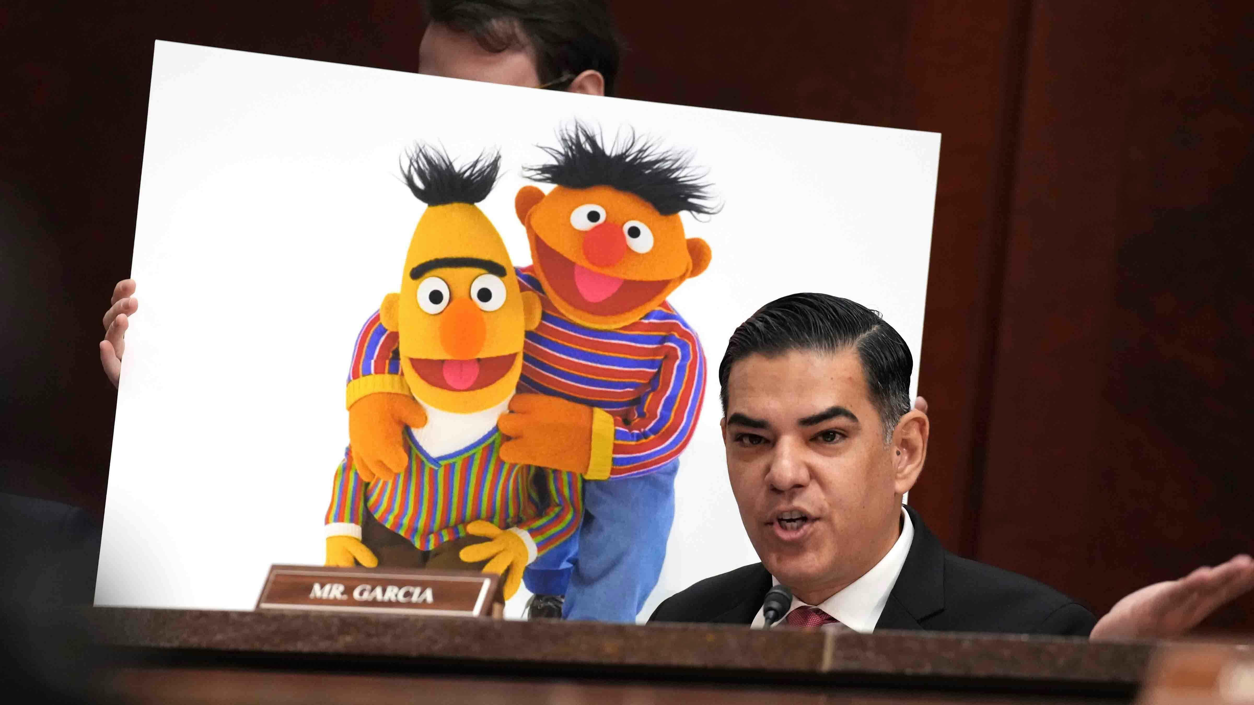 U.S. Rep. Robert Garcia (D-CA) speaks in front of poster of Sesame Street's Bert and Ernie during a House Oversight and Government Reform Committee hearing at the U.S. Capitol on