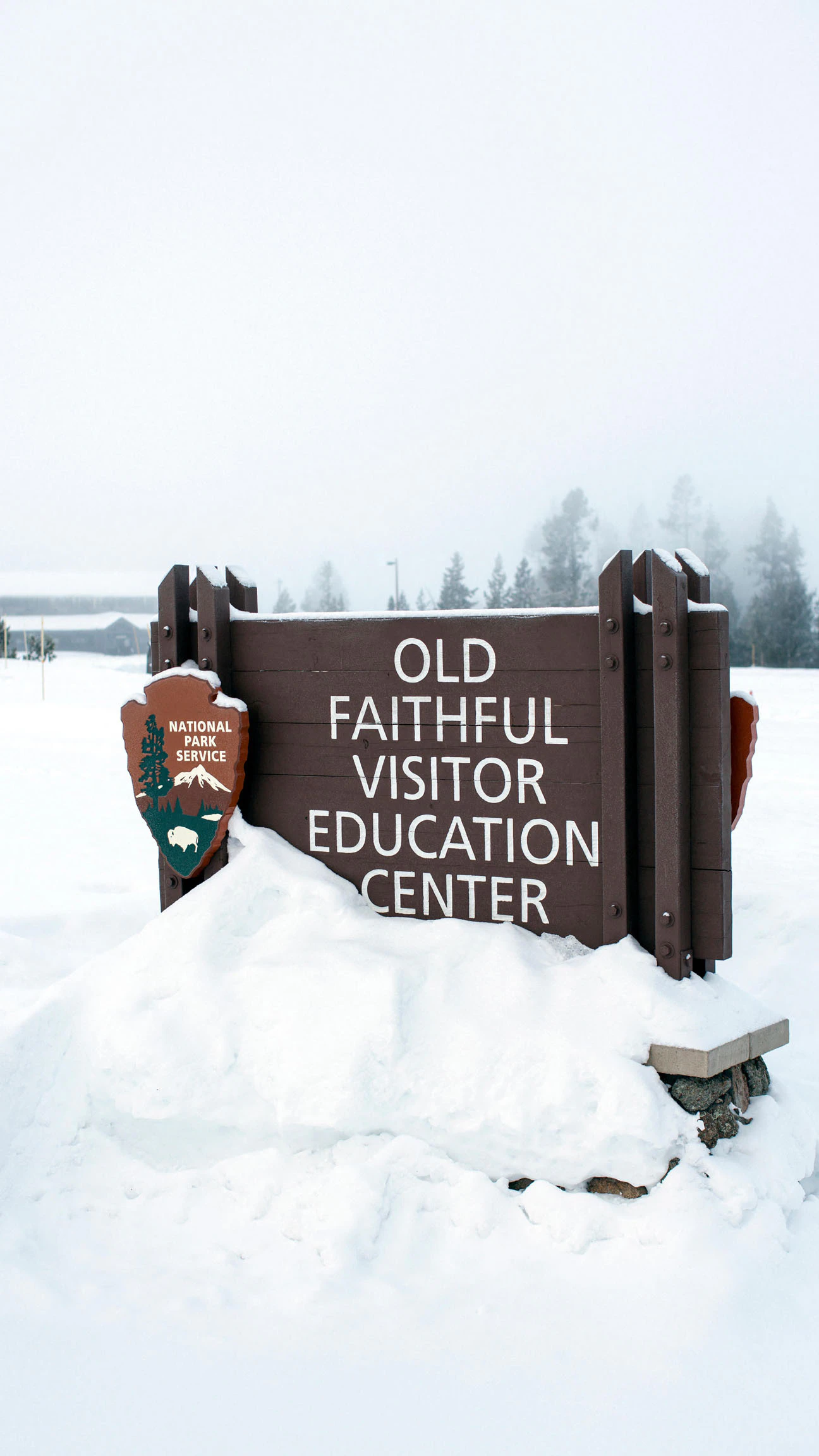 snow packed sign near the visitor center at Old Faithful, Upper Geyser Basin