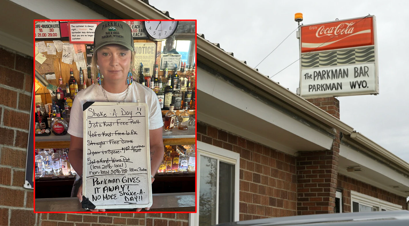 The bartender at Parkman Bar and Grill in Sheridan holds the bar’s sign announcing a farewell to shake a day, as state gambling laws tighten