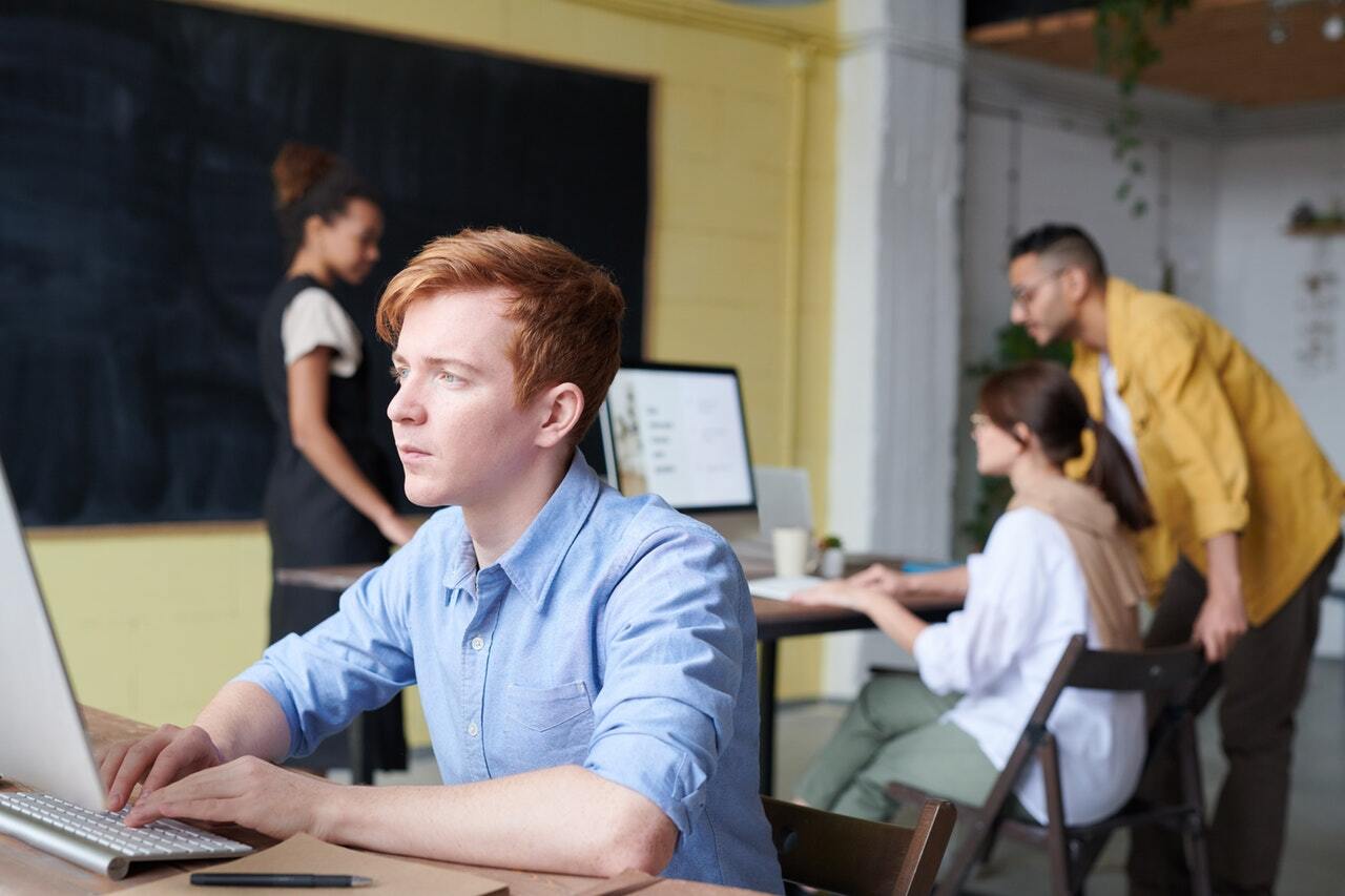 Photo of man using computer 3184648