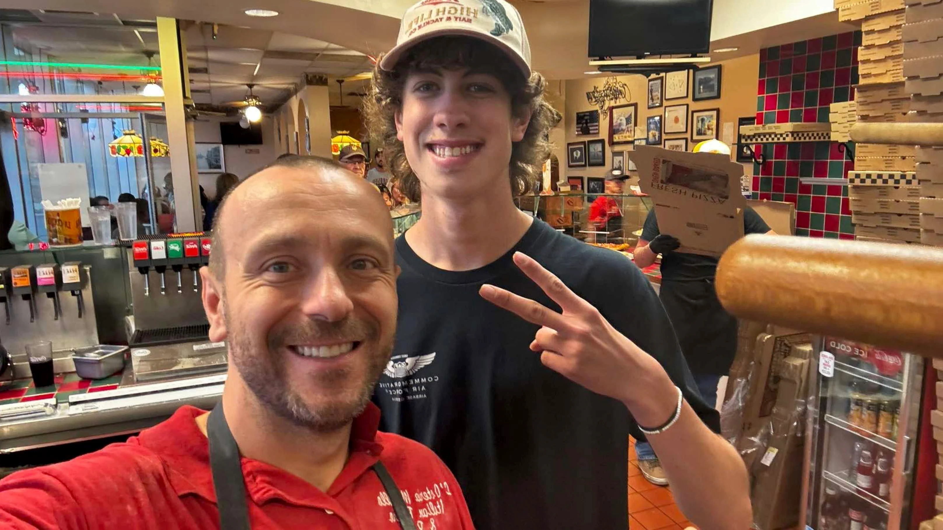 L’Osteria Mondello owner Dave Agovic, left, with Ryan Lemley, who delivered the 18 unclaimed pizzas to the ER.