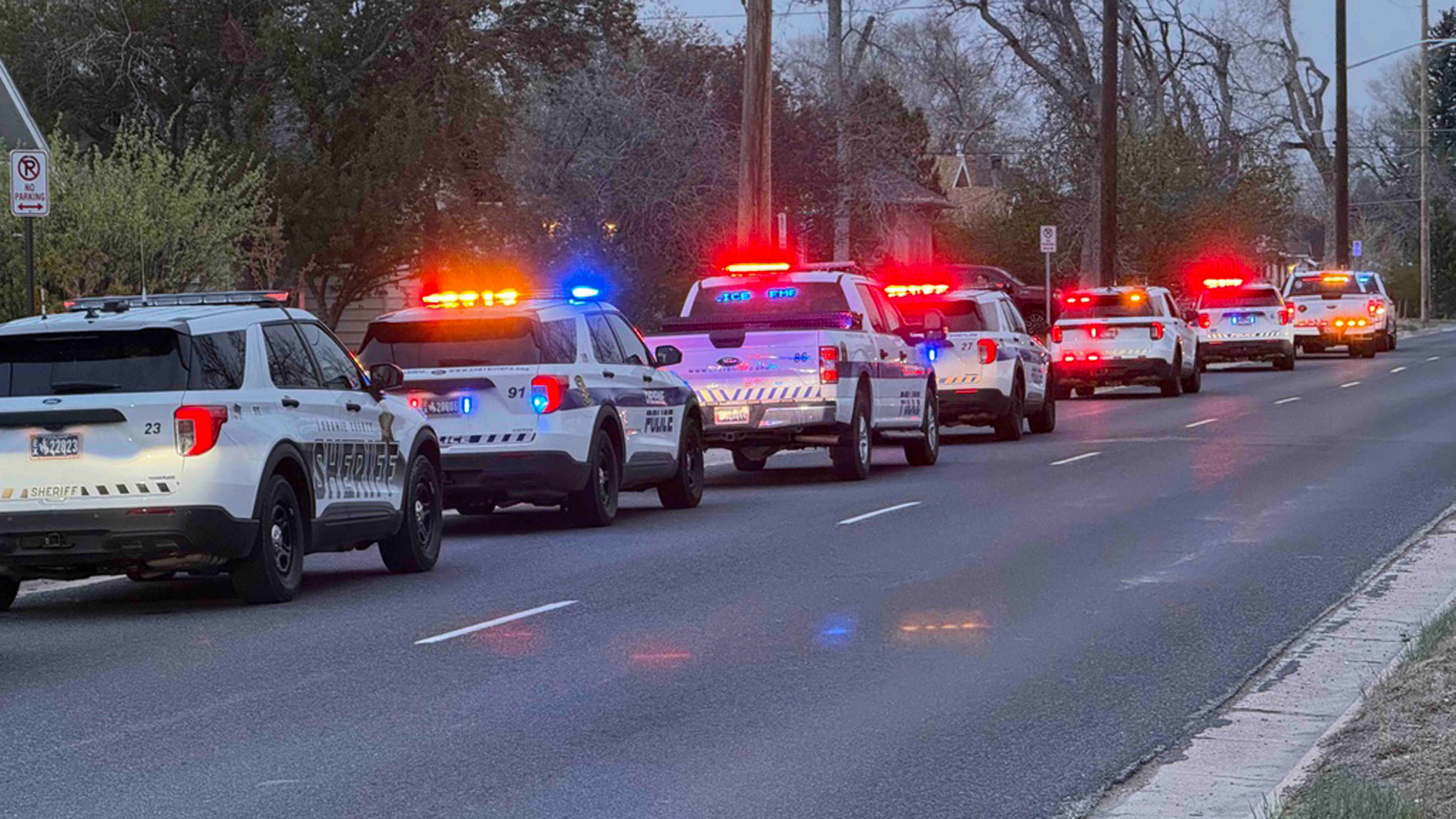 Dozens of law enforcement vehicles lined up on Warren Ave. and Central Ave. on Thursday morning. Officers were responding to a shooting in Cheyenne.