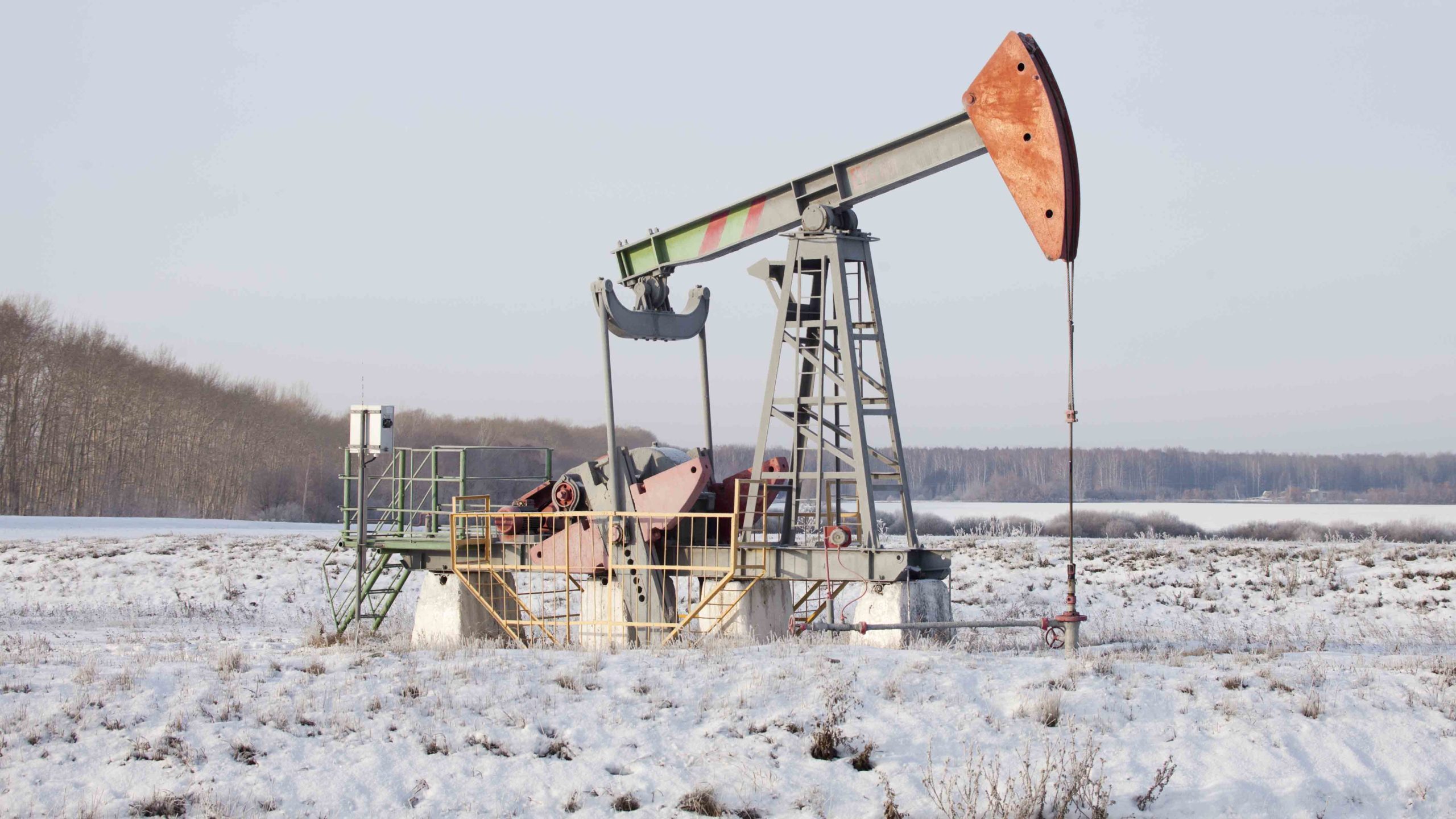 Pumpjack in the snow scaled
