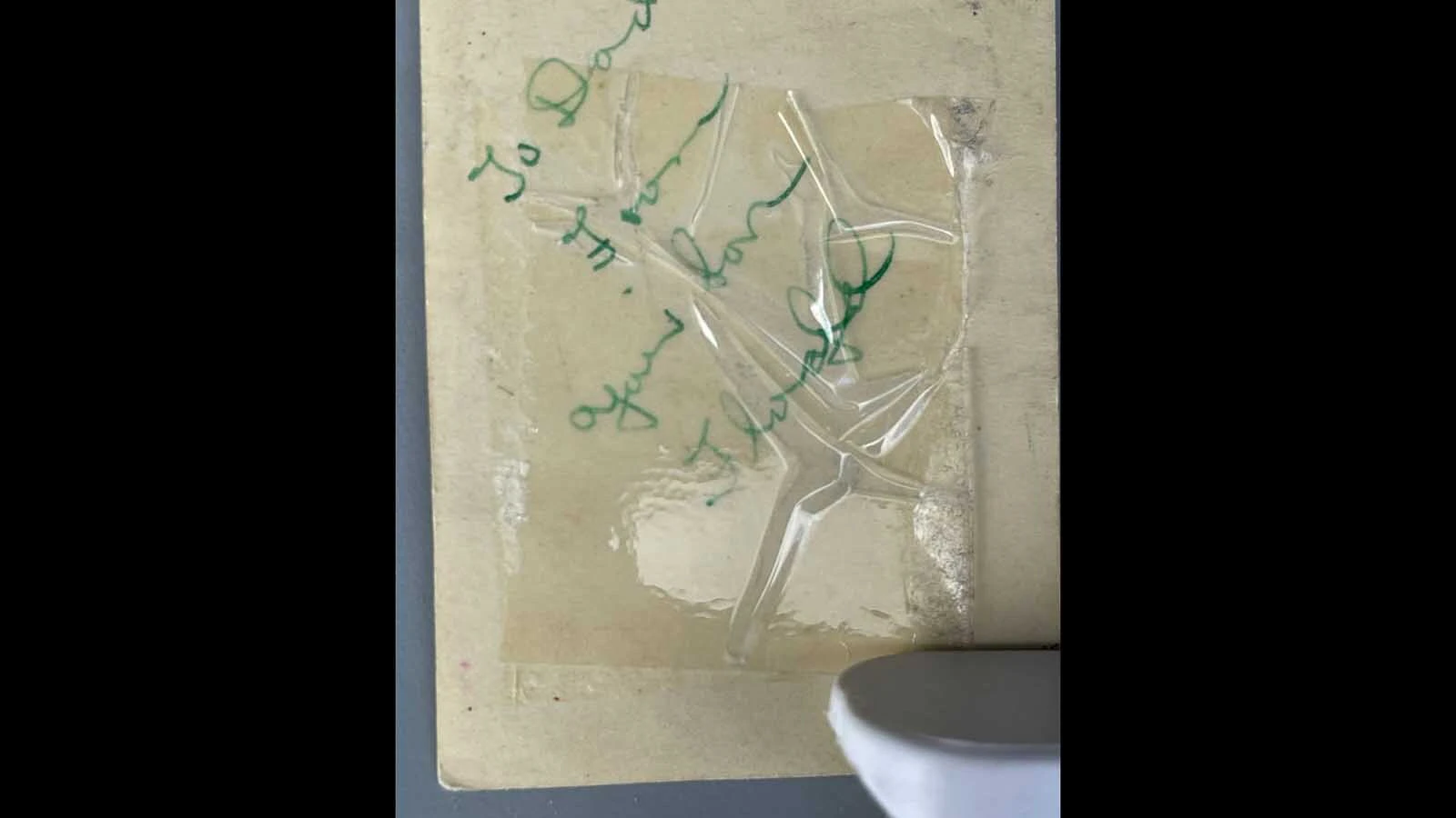 The message found behind one of the photos that was attached to the American flag.