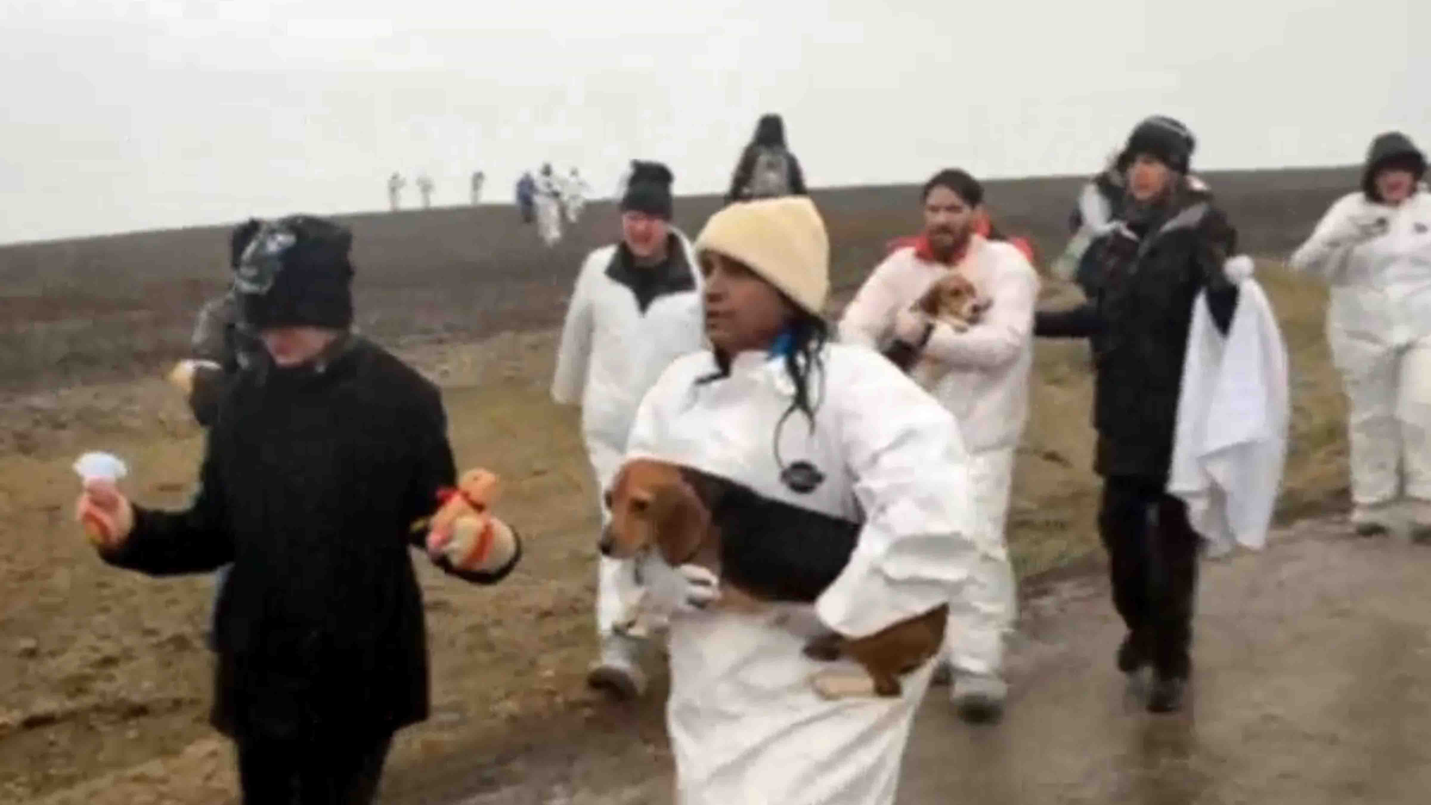 Madhu Anderson (carrying beagle), who is from Rock Springs, was among the 27 animal rights activists arrested on March 15 after breaking into a Wisconsin biomedical research facility and taking 30 beagles. 