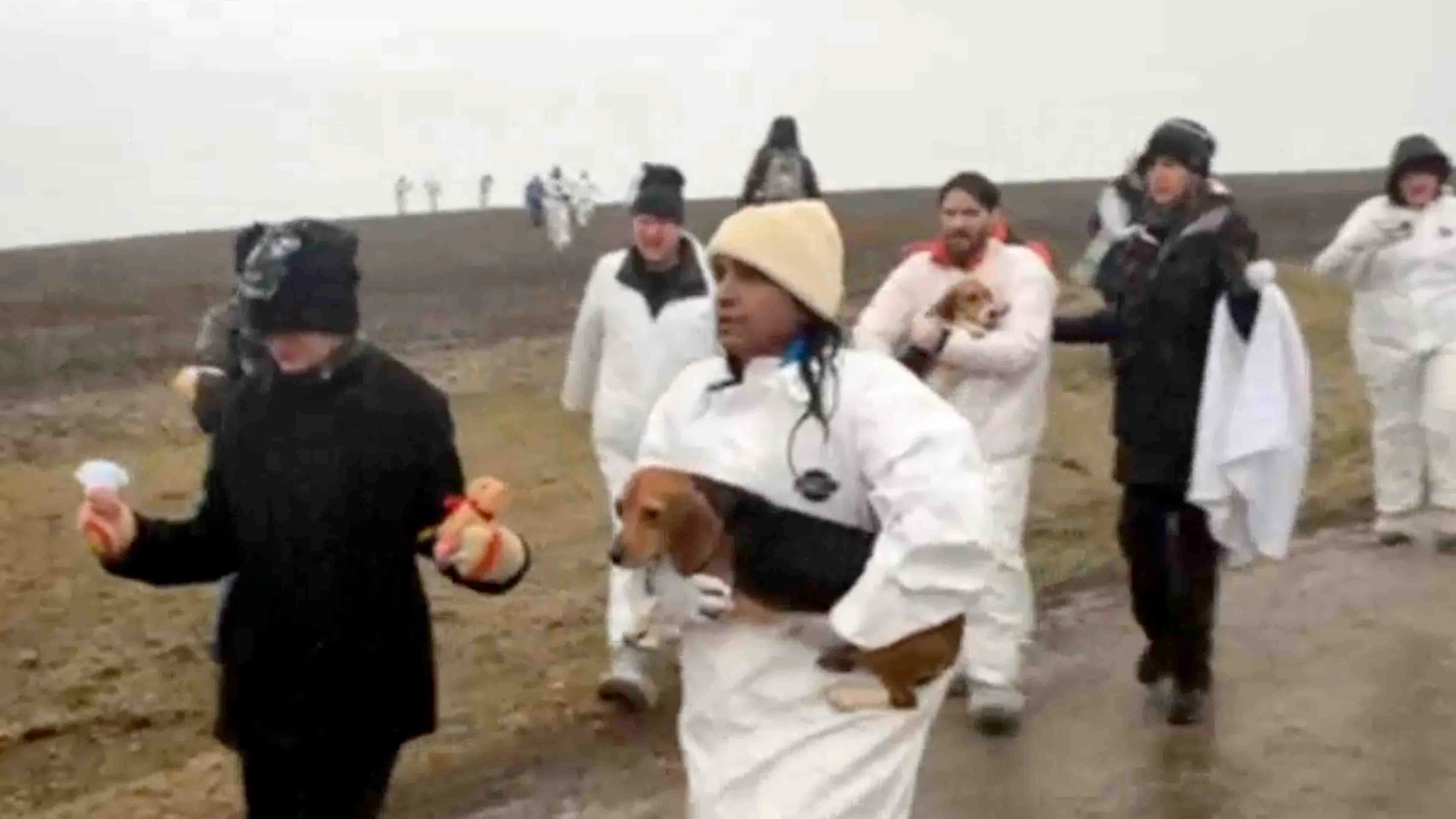 Madhu Anderson (carrying beagle), who is from Rock Springs, was among the 27 animal rights activists arrested on March 15 after breaking into a Wisconsin biomedical research facility and taking 30 beagles. 
